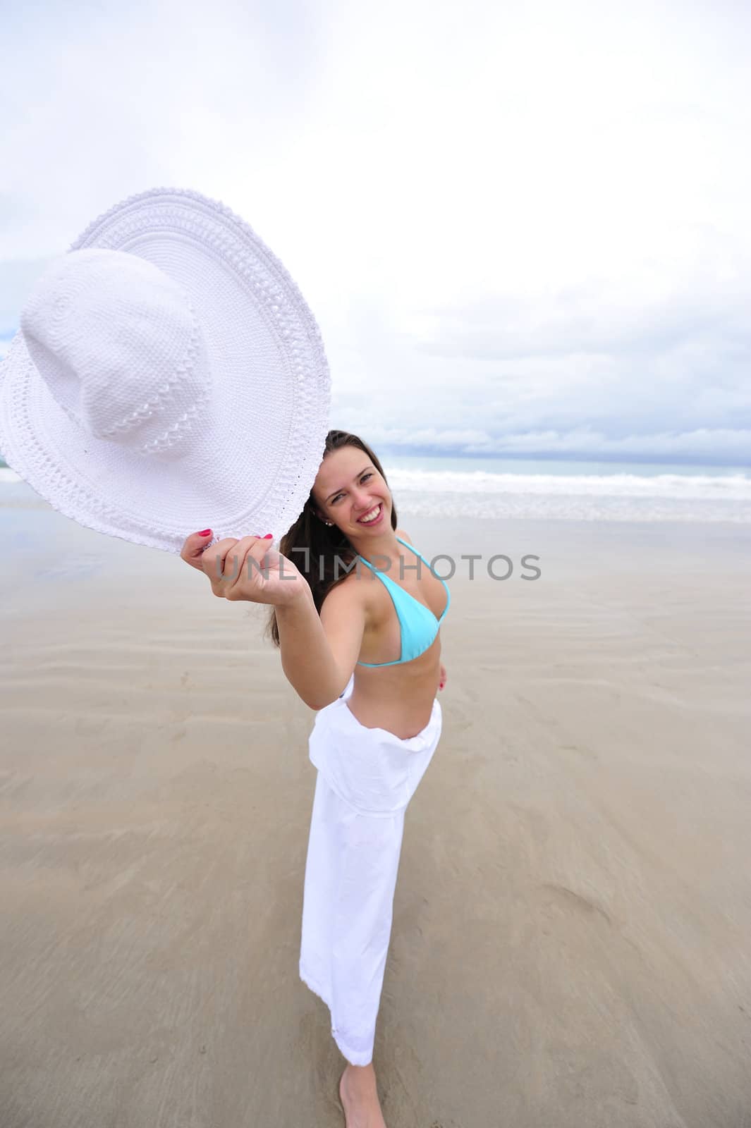 woman enjoying her holiday on a tropical beach in Brazil
