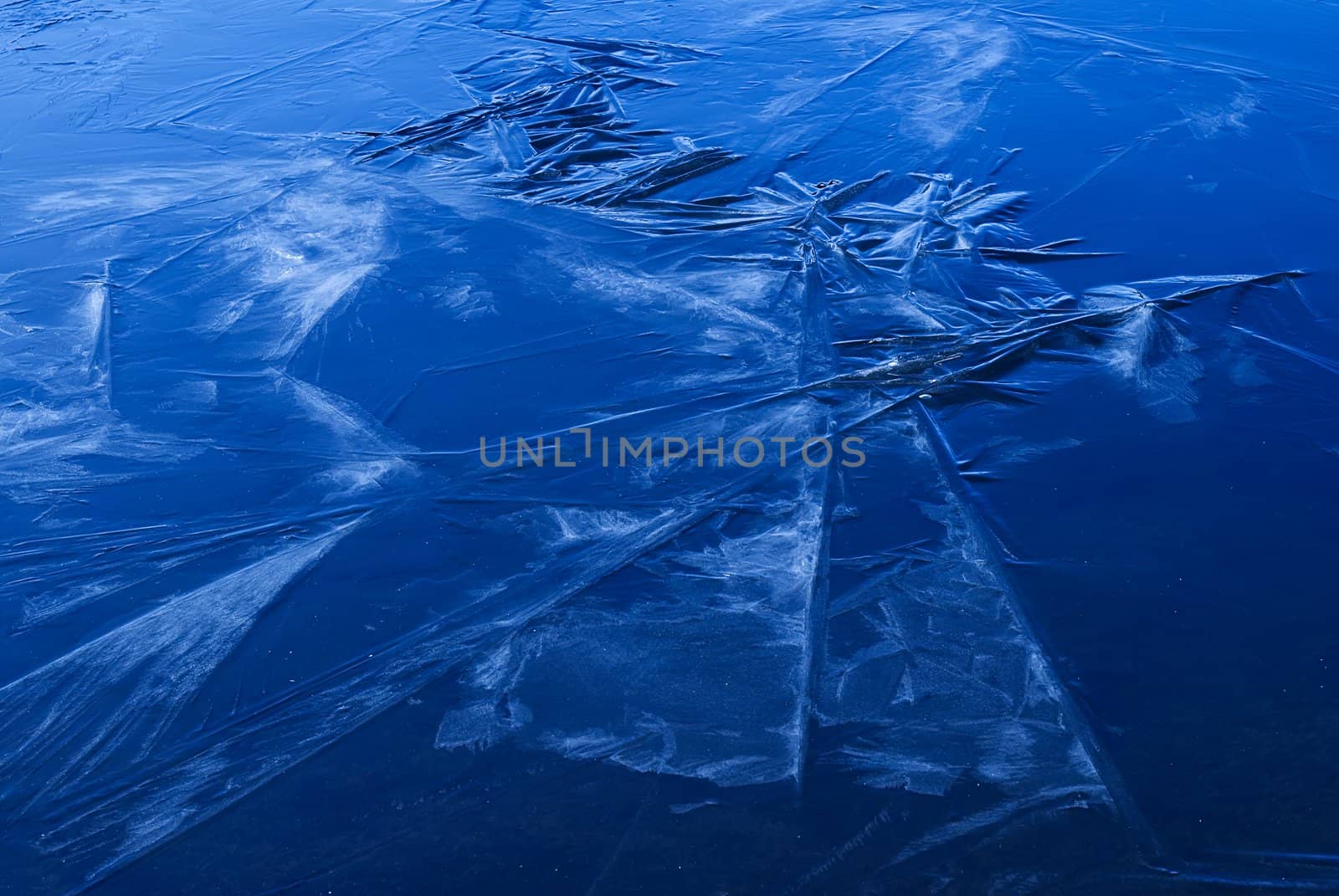 Beautiful strange iced pond surface texture in white.