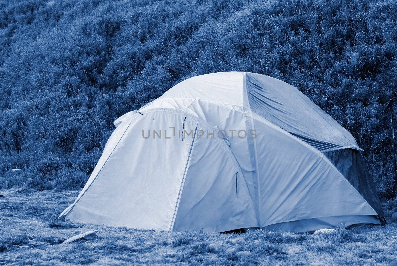 A forzen small tent in cold high moutain.