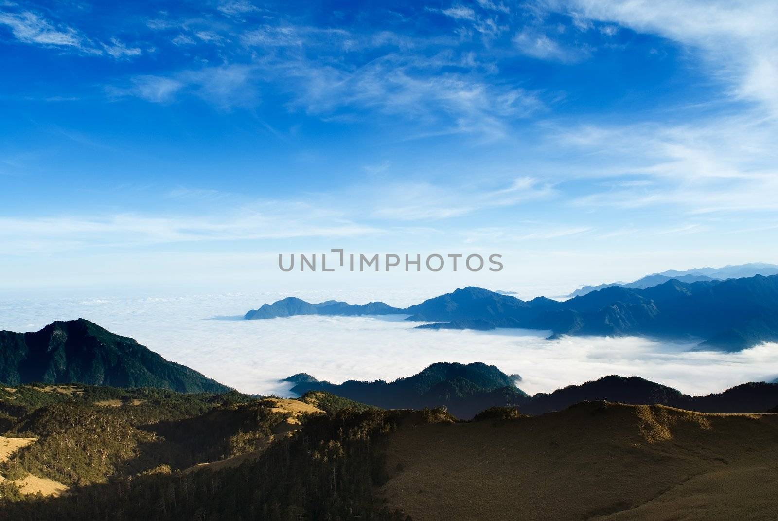 Clouds like sea and waterfall in high mountain.