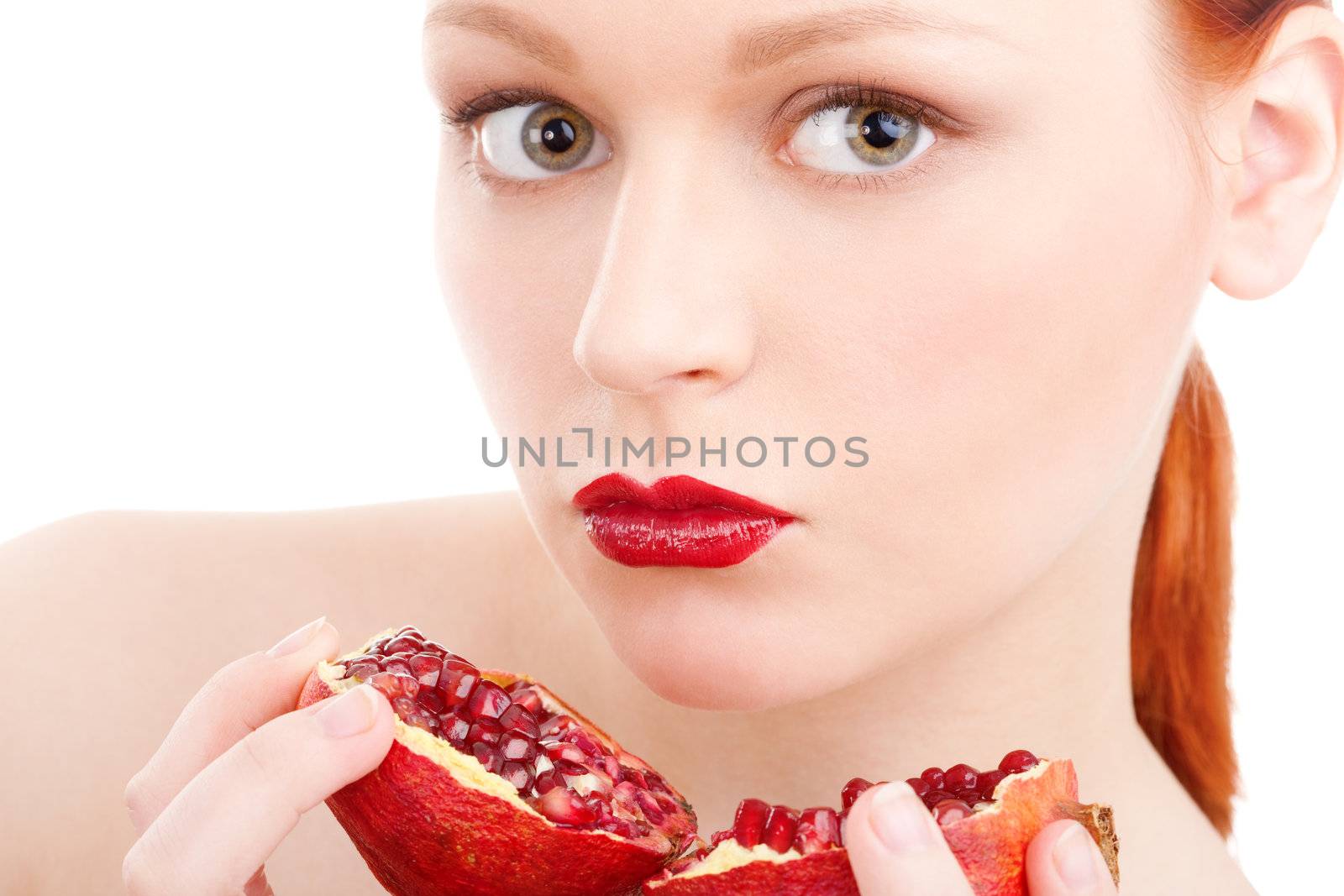 Young girl pomegranate on isolated white background