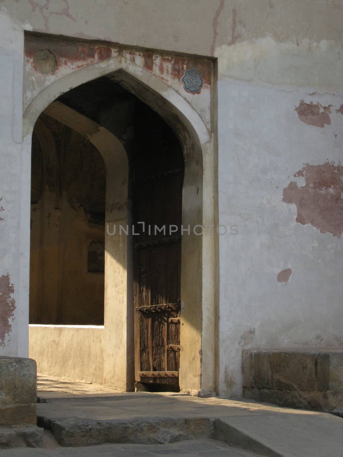 Evening light streaming through an old doorway