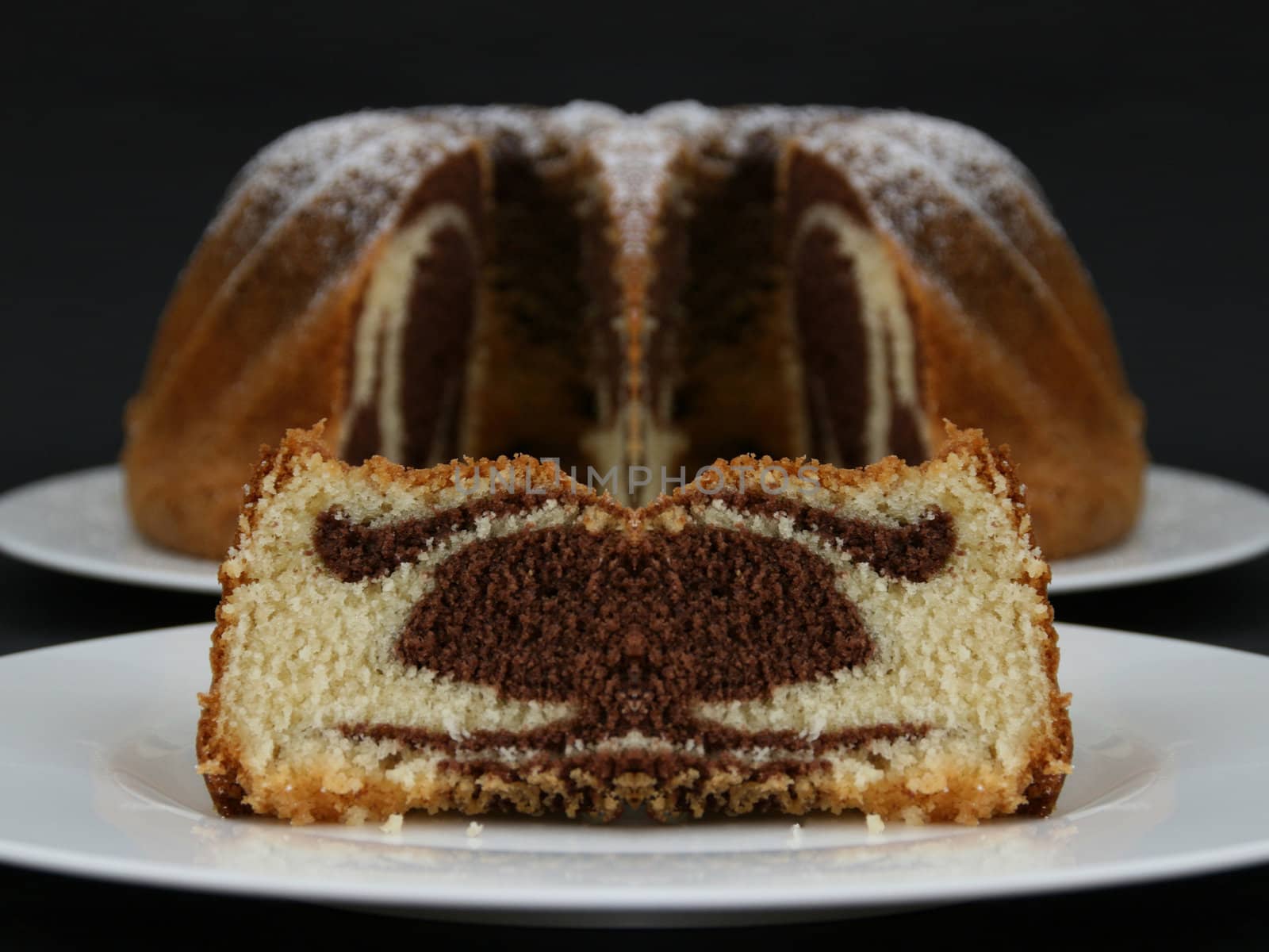 Double Chocolate fondant filled Muffin isolated against black background.