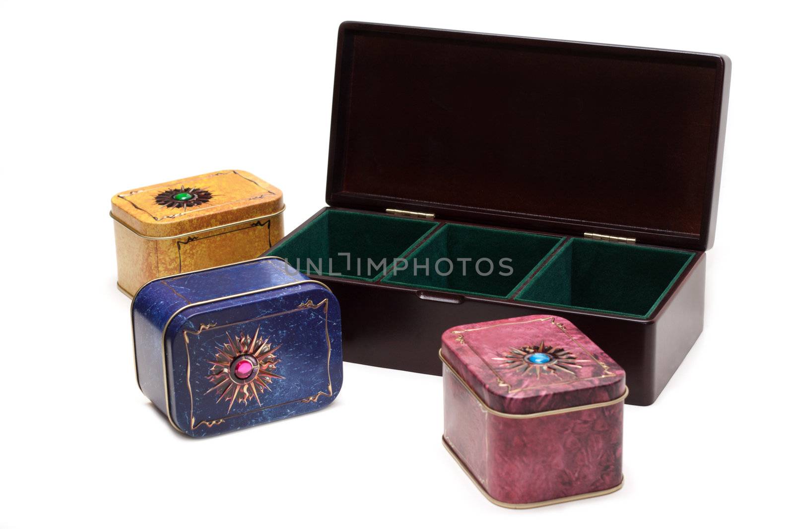 Box with tea, iron packing, decorated stone on white background