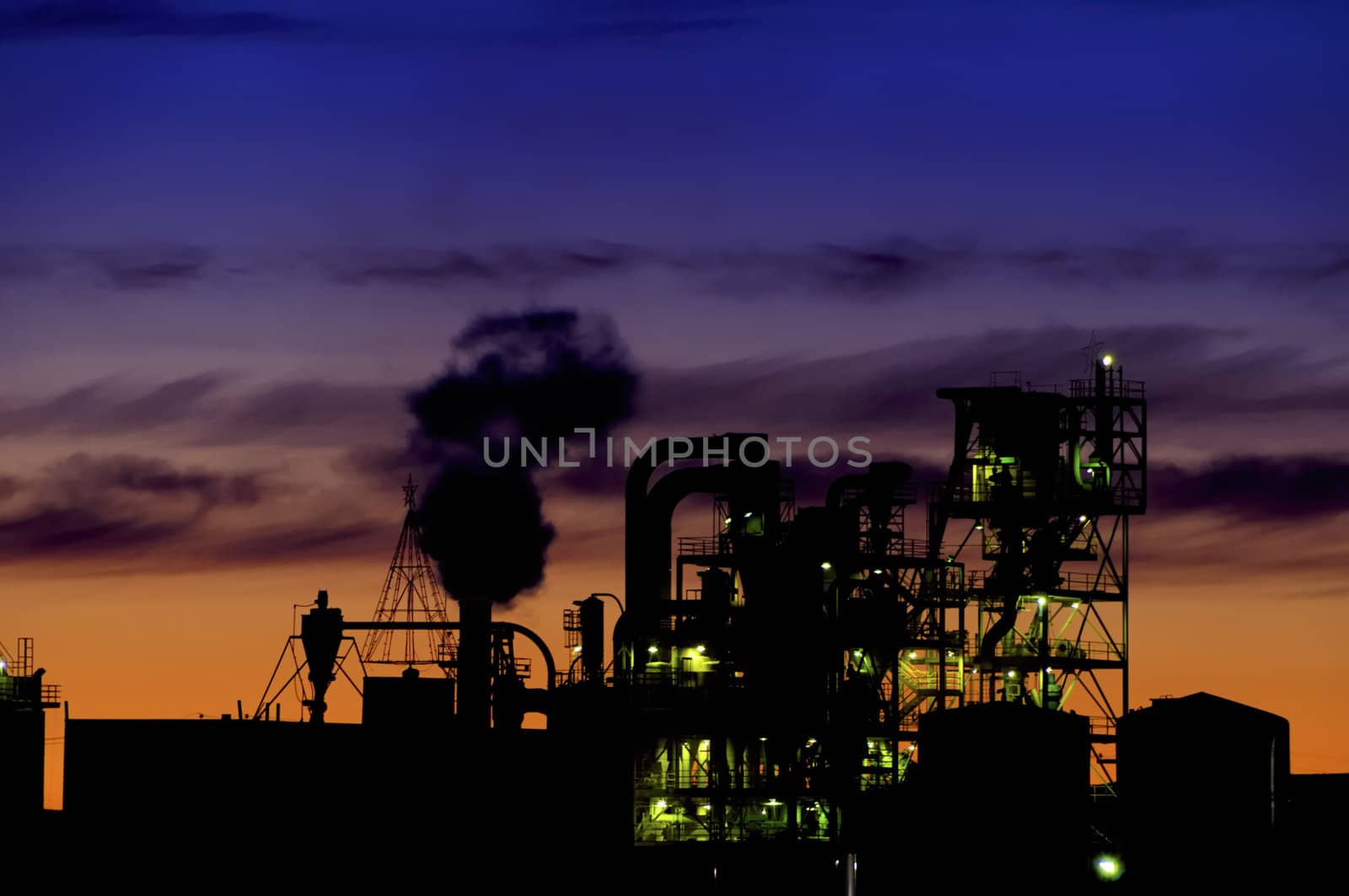 Sunset over a grain processing plant