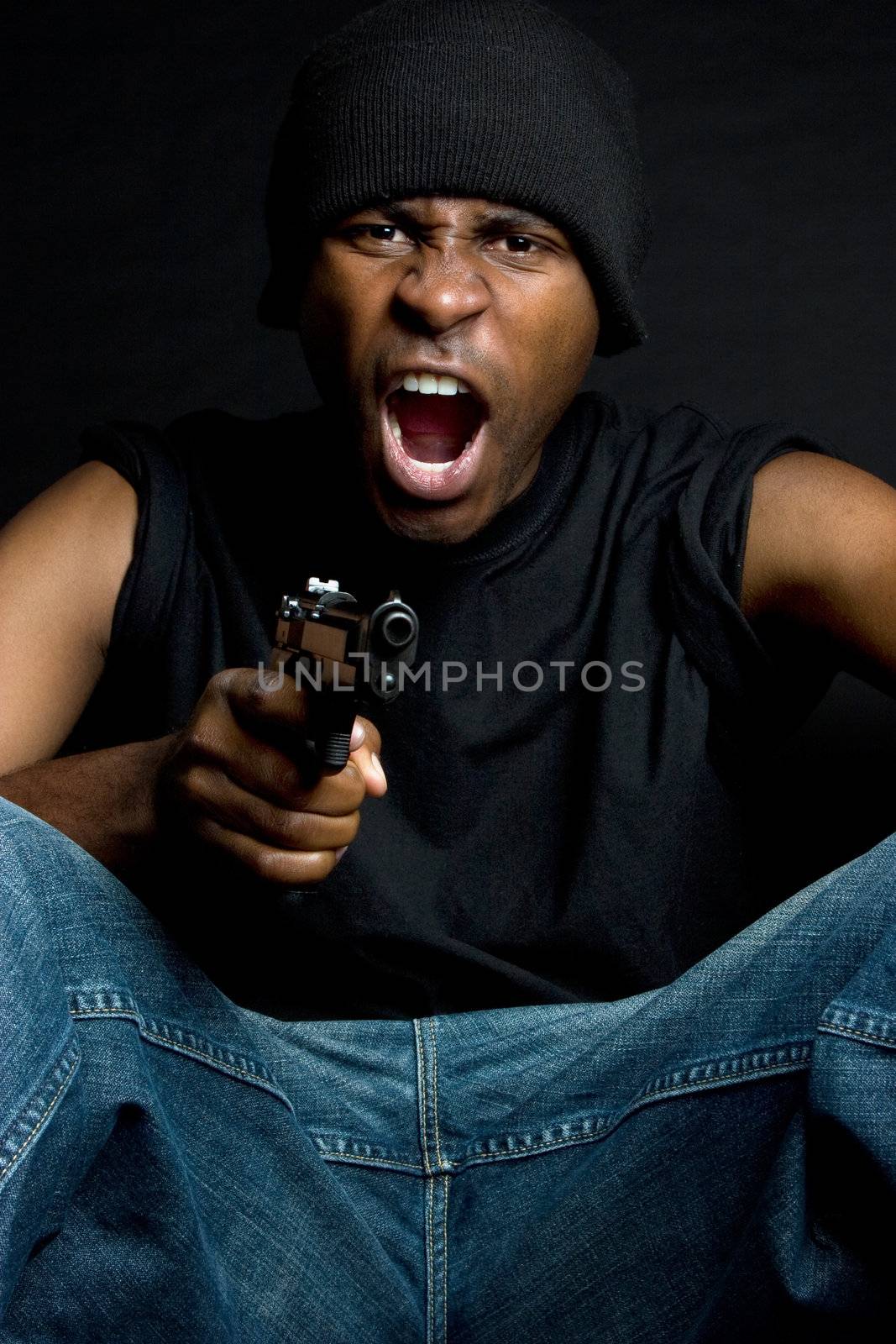 African american gangster holding gun