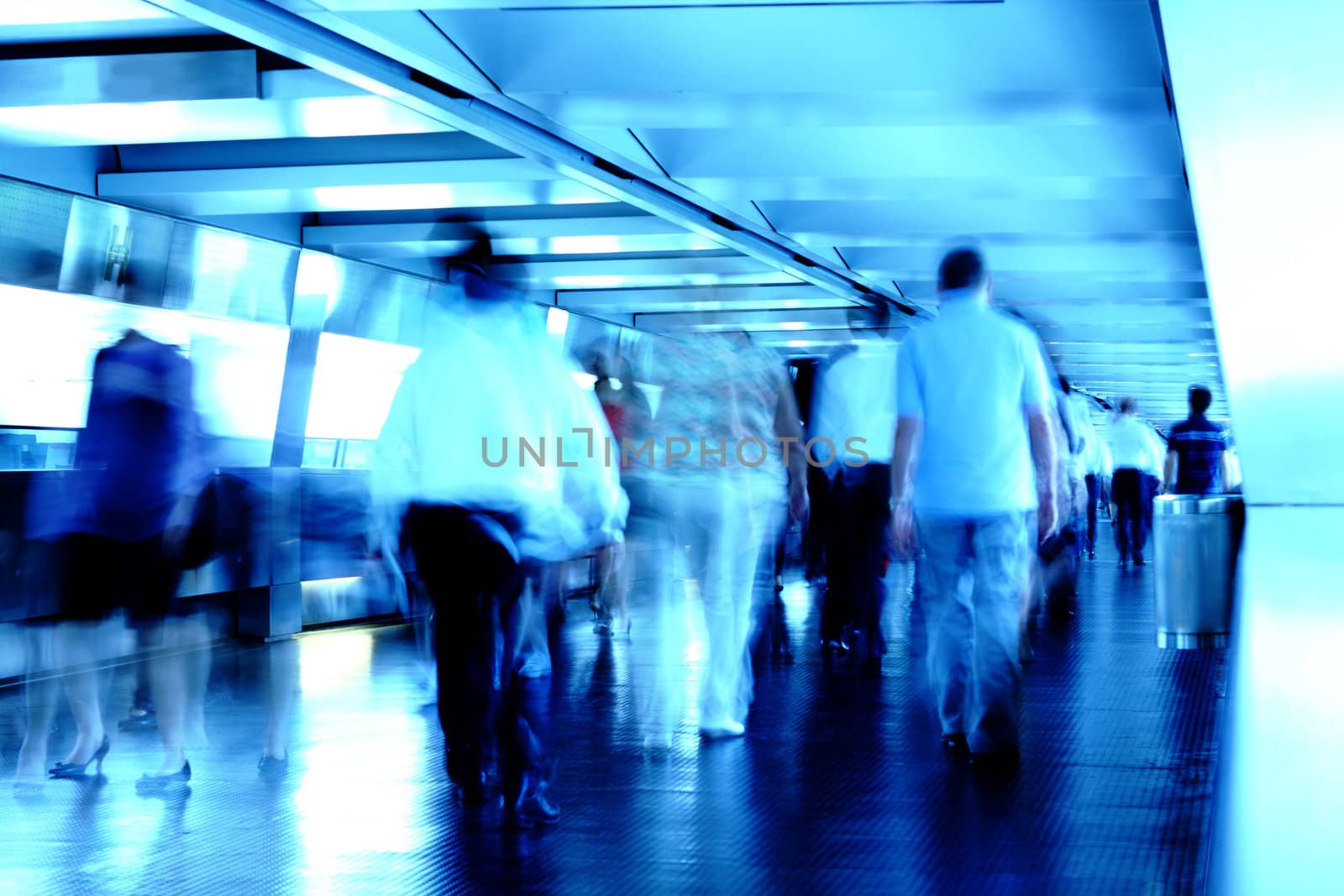 busy people in blured motion on footbridge