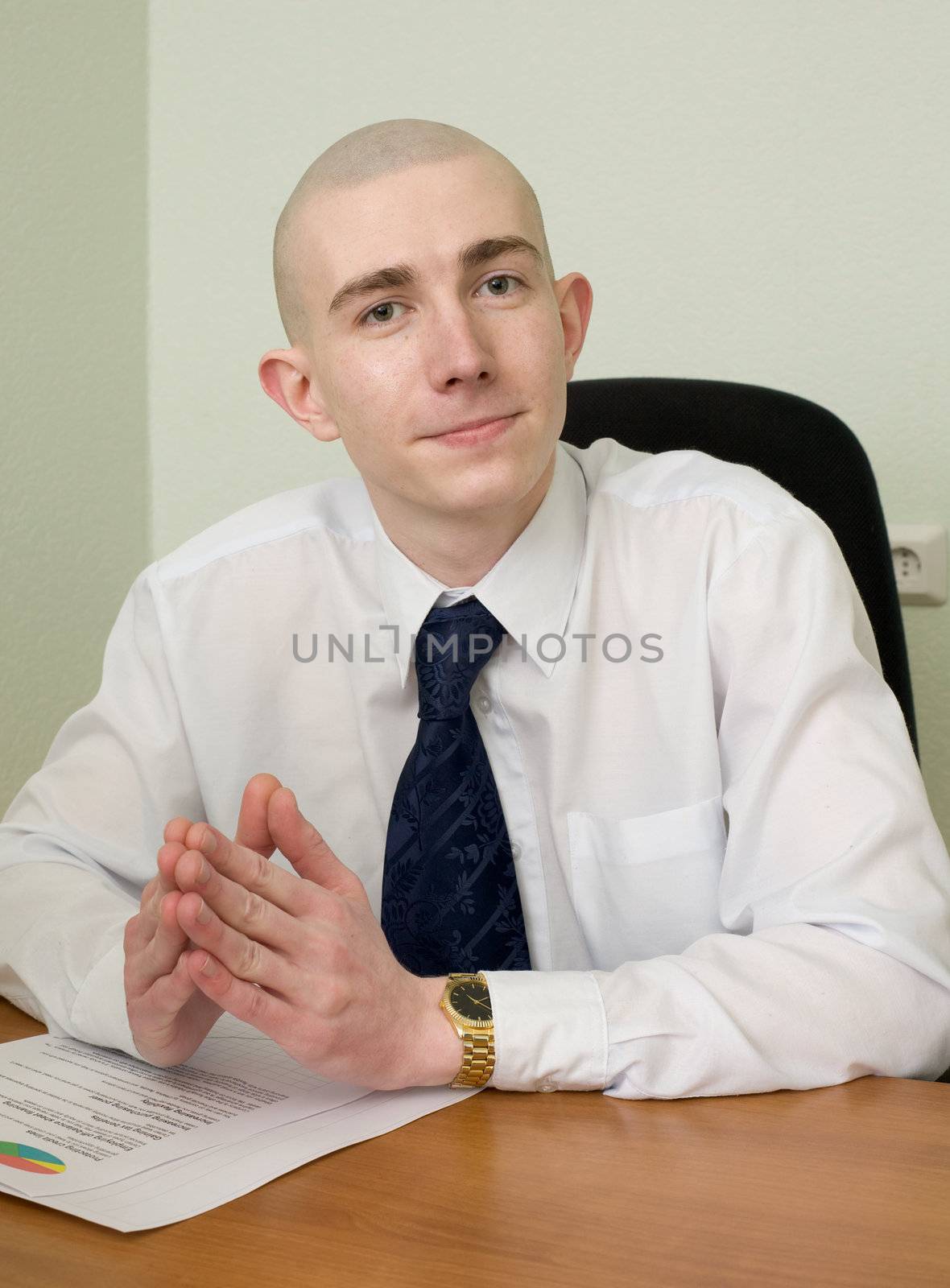 The businessman in a white shirt on a workplace