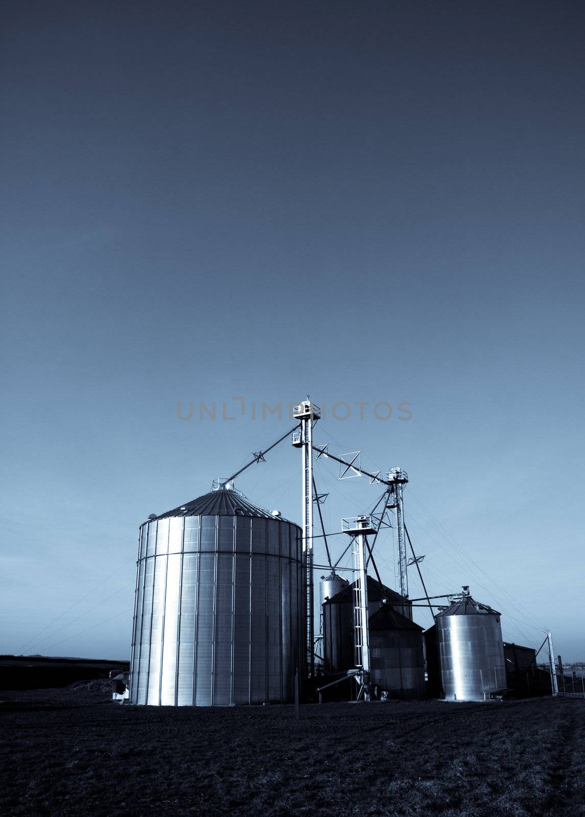 Modern farmer silos factory in open fields