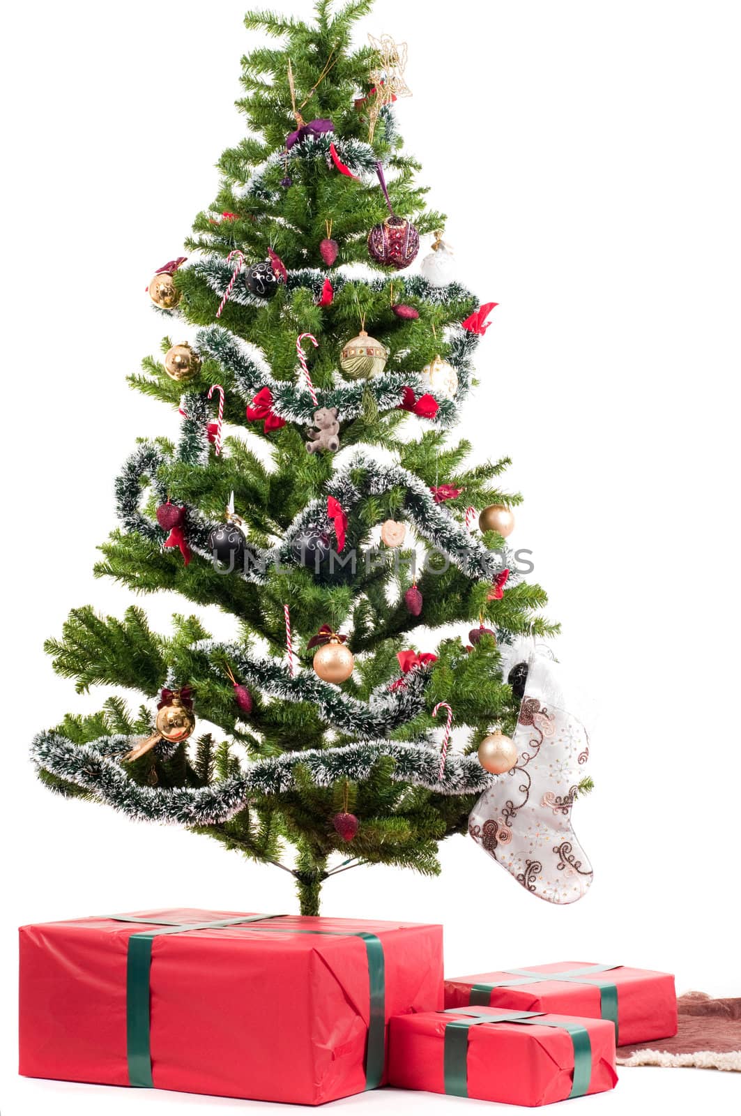 Christmas tree with presents isolated on white