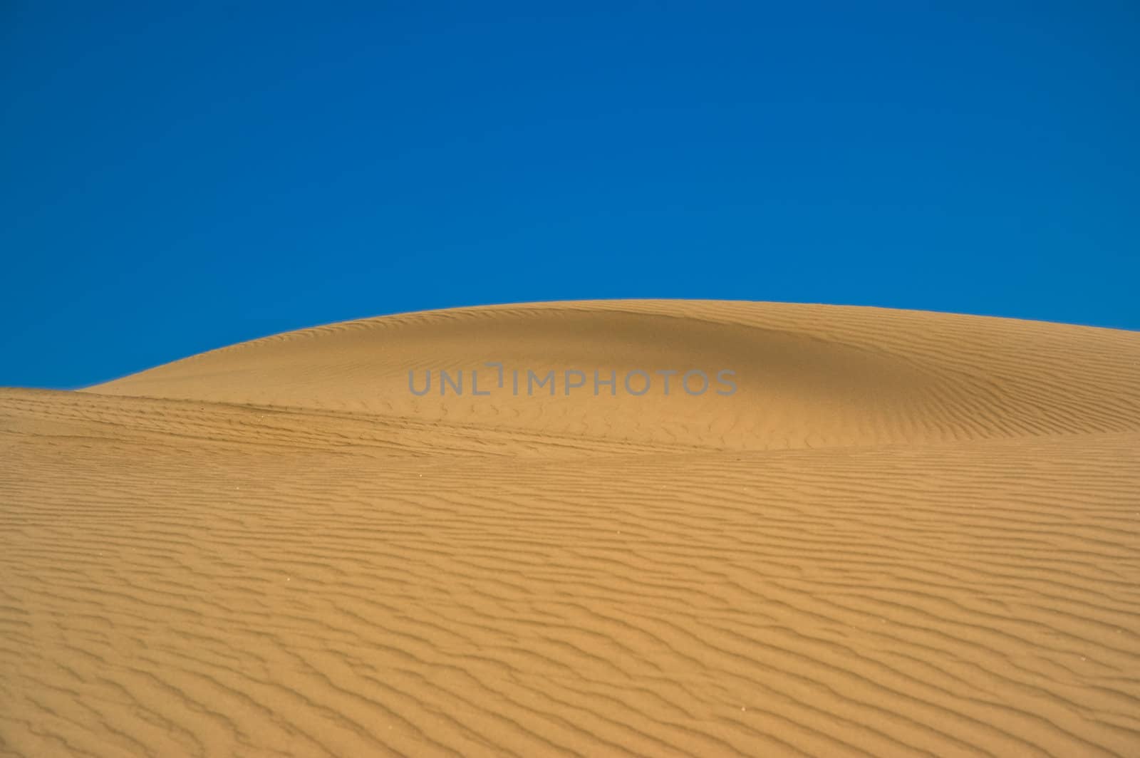 Sand dune against the sky in Patagonia, Argentina.