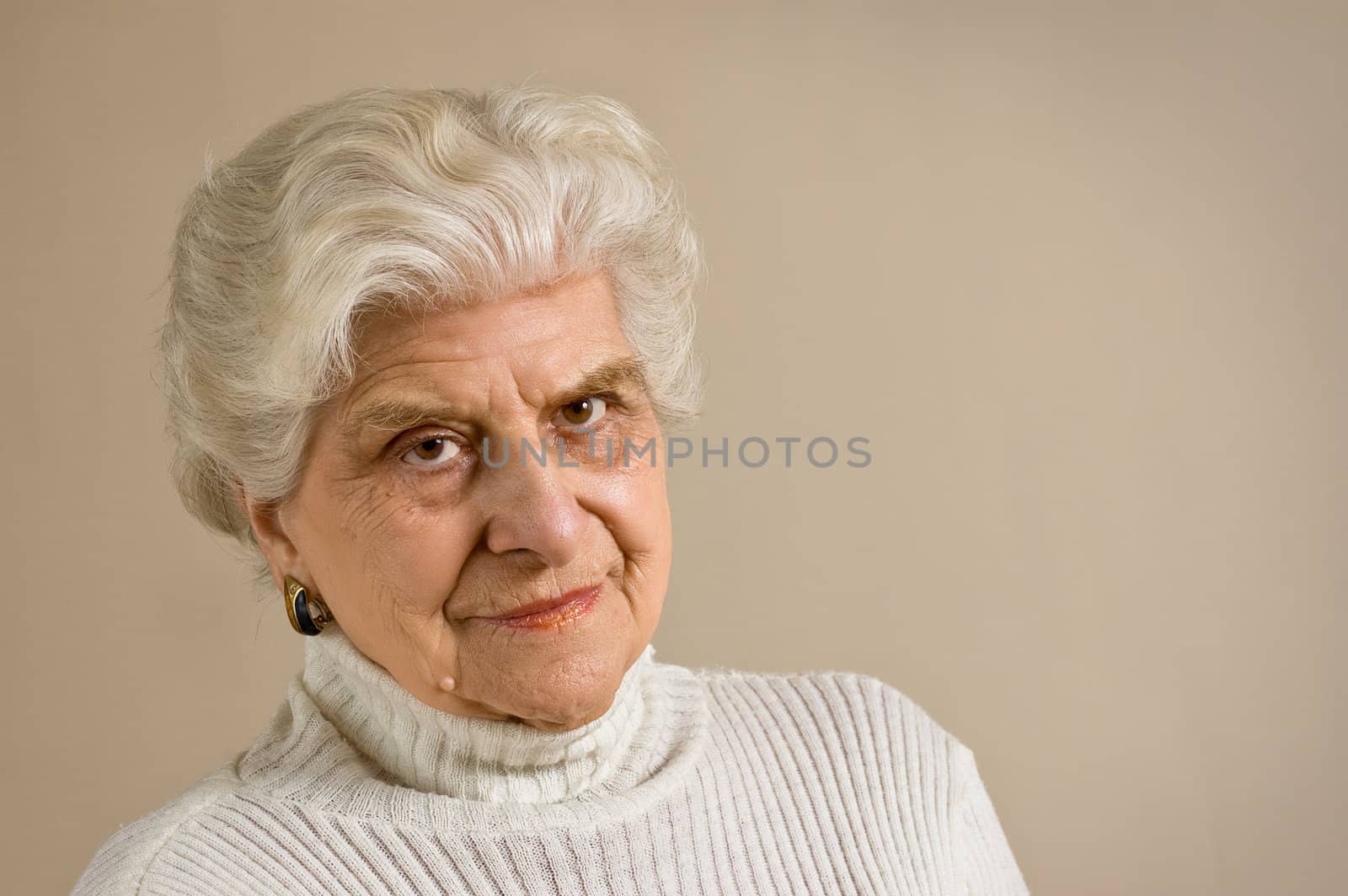 Senior lady portrait, looking to cammera,  with copy space.