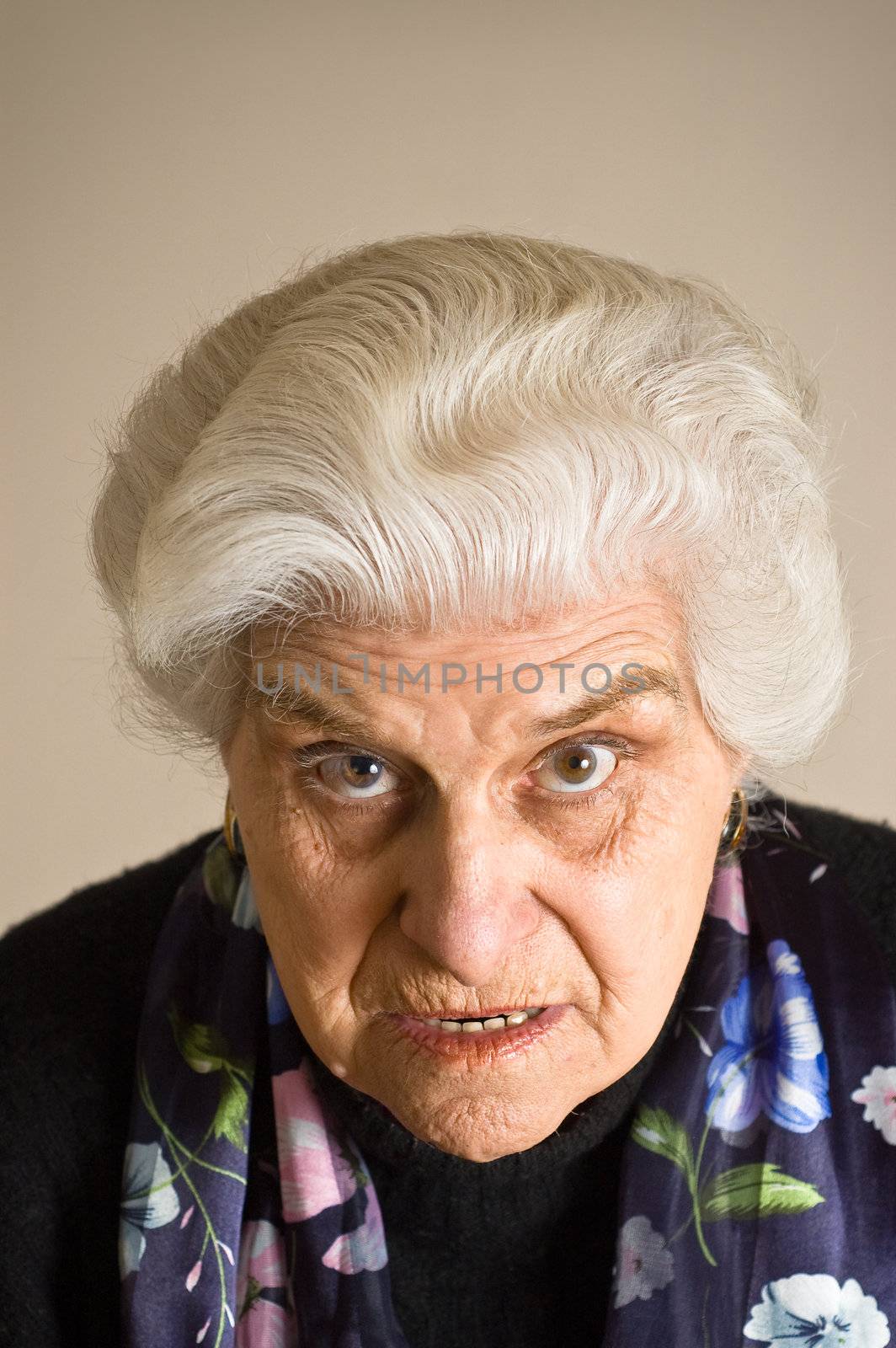 Portrait of an angry mature woman, looking to cammera.