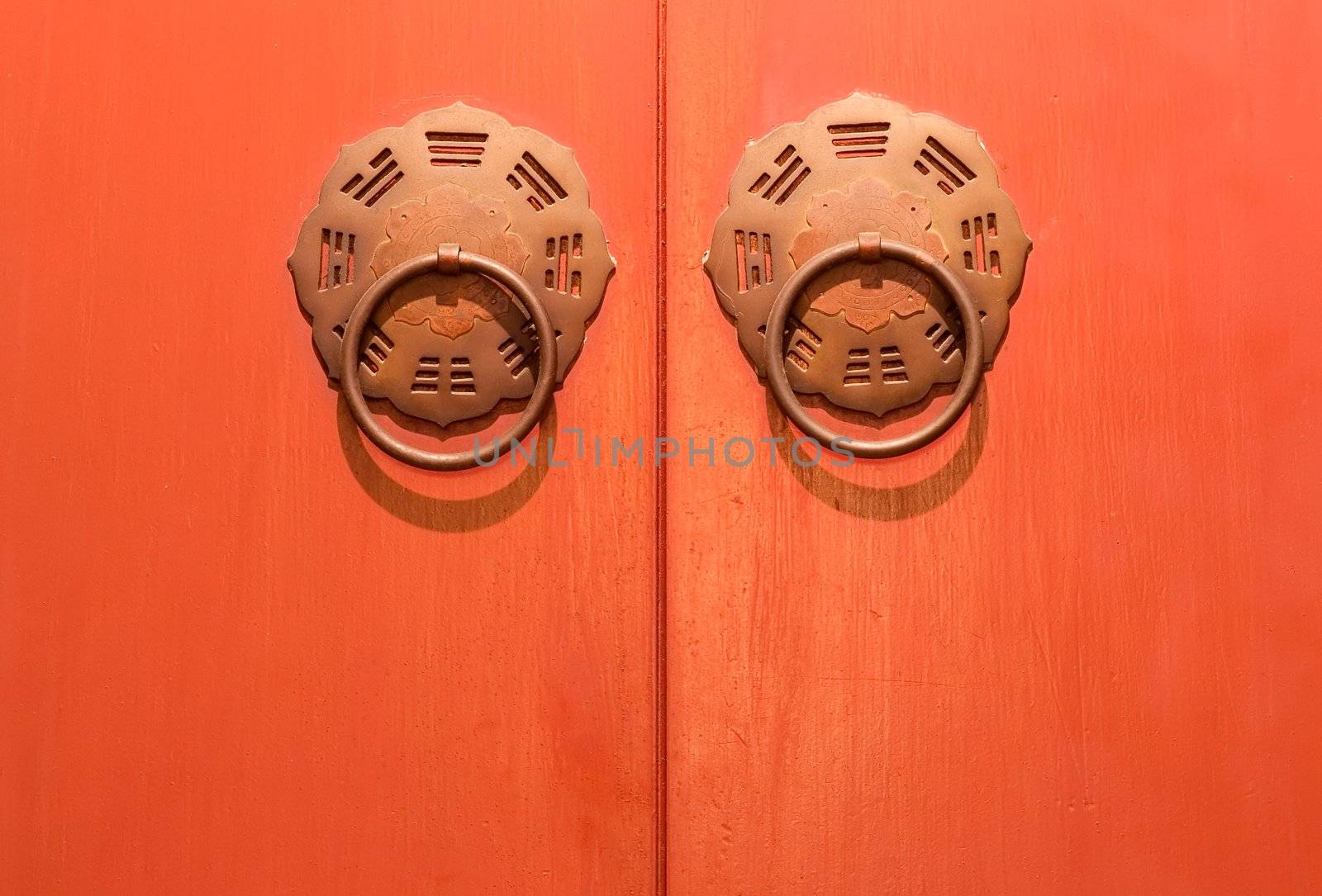 Traditional chinese door in orange and golden color.