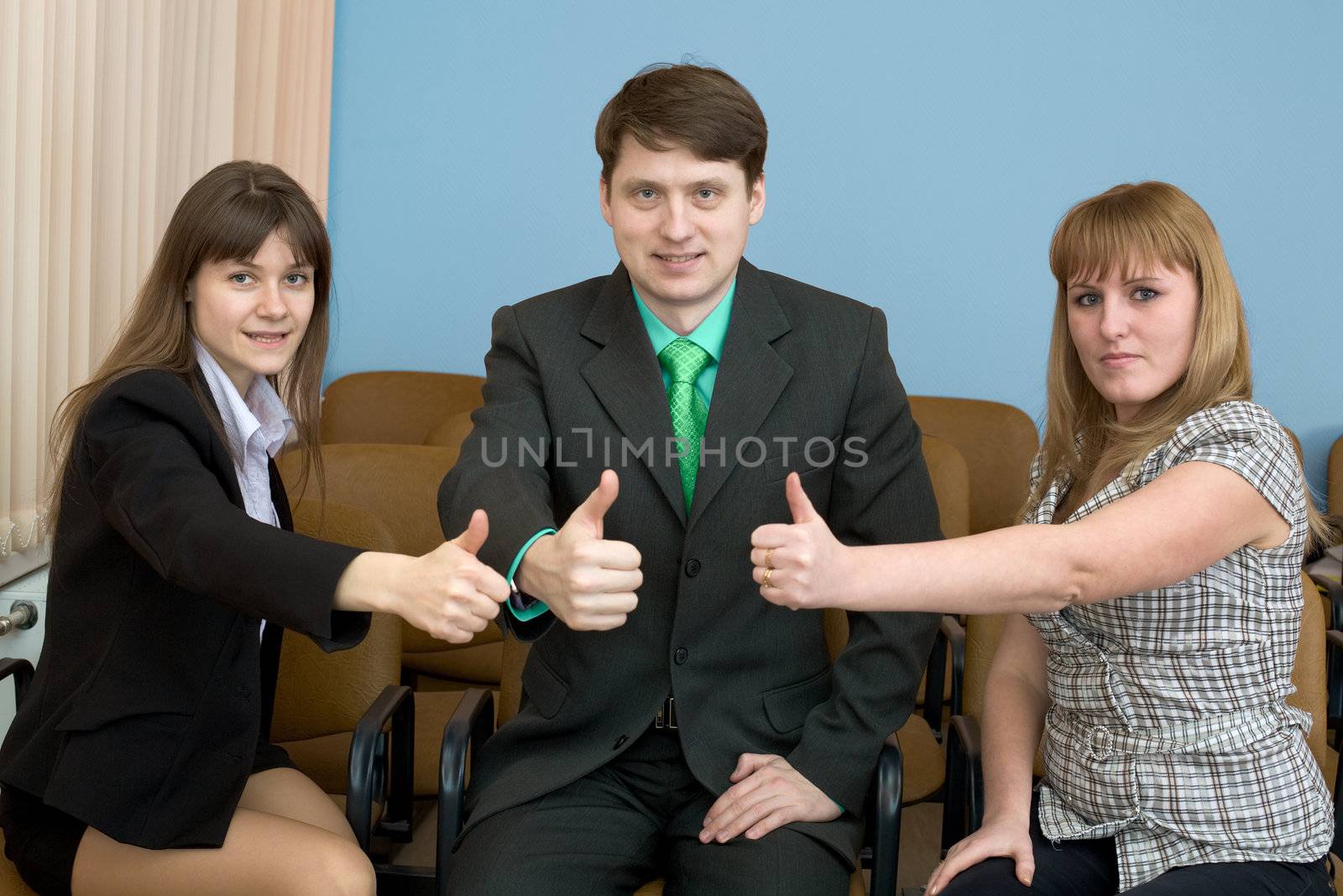 Team of businessmen show thumb up by pzaxe