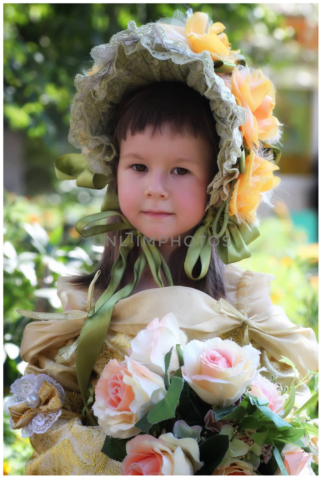 Color portrait of little girl in retro style in dress and hat with flowers