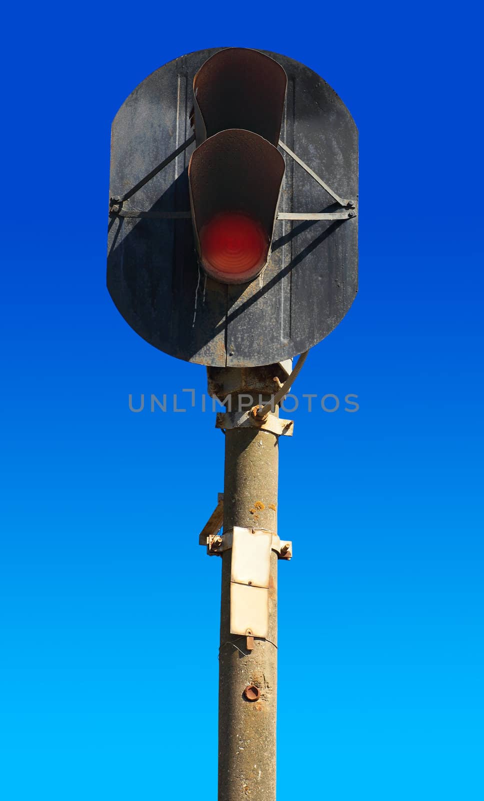 old railway semaphore on a background of pure blue sky