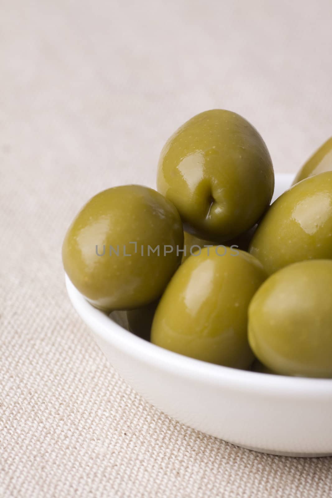 bowl full of green greek olives - healthy eating