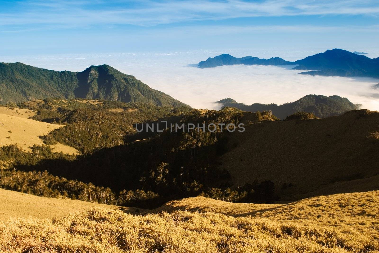 Clouds like sea and waterfall in high mountain. by elwynn