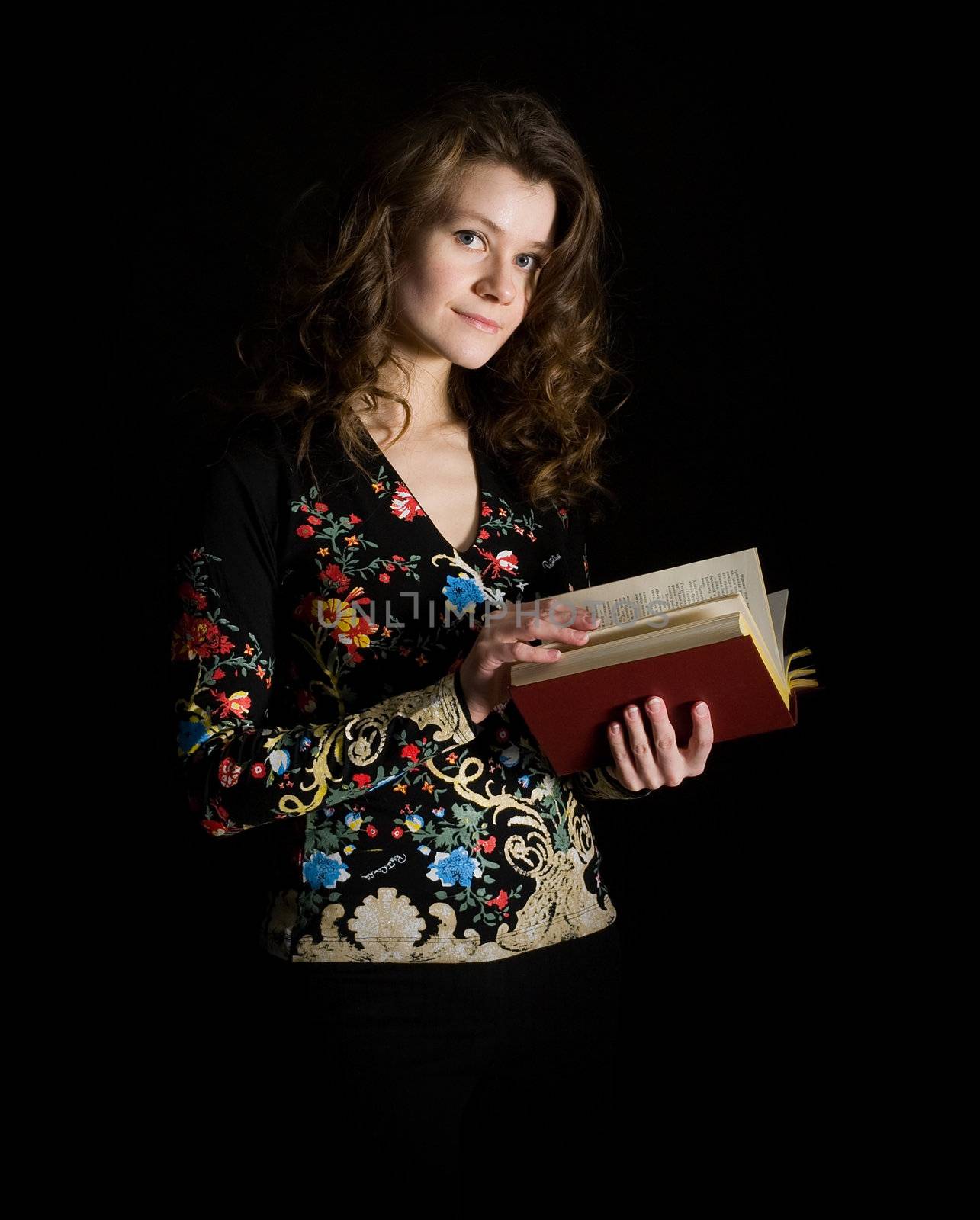 Girl with book on black background by pzaxe