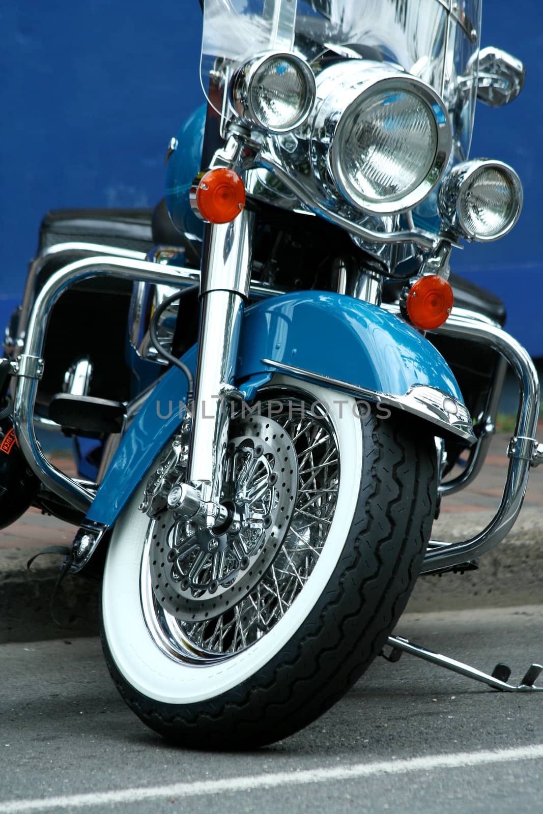 A blue motorcycle parked in the street