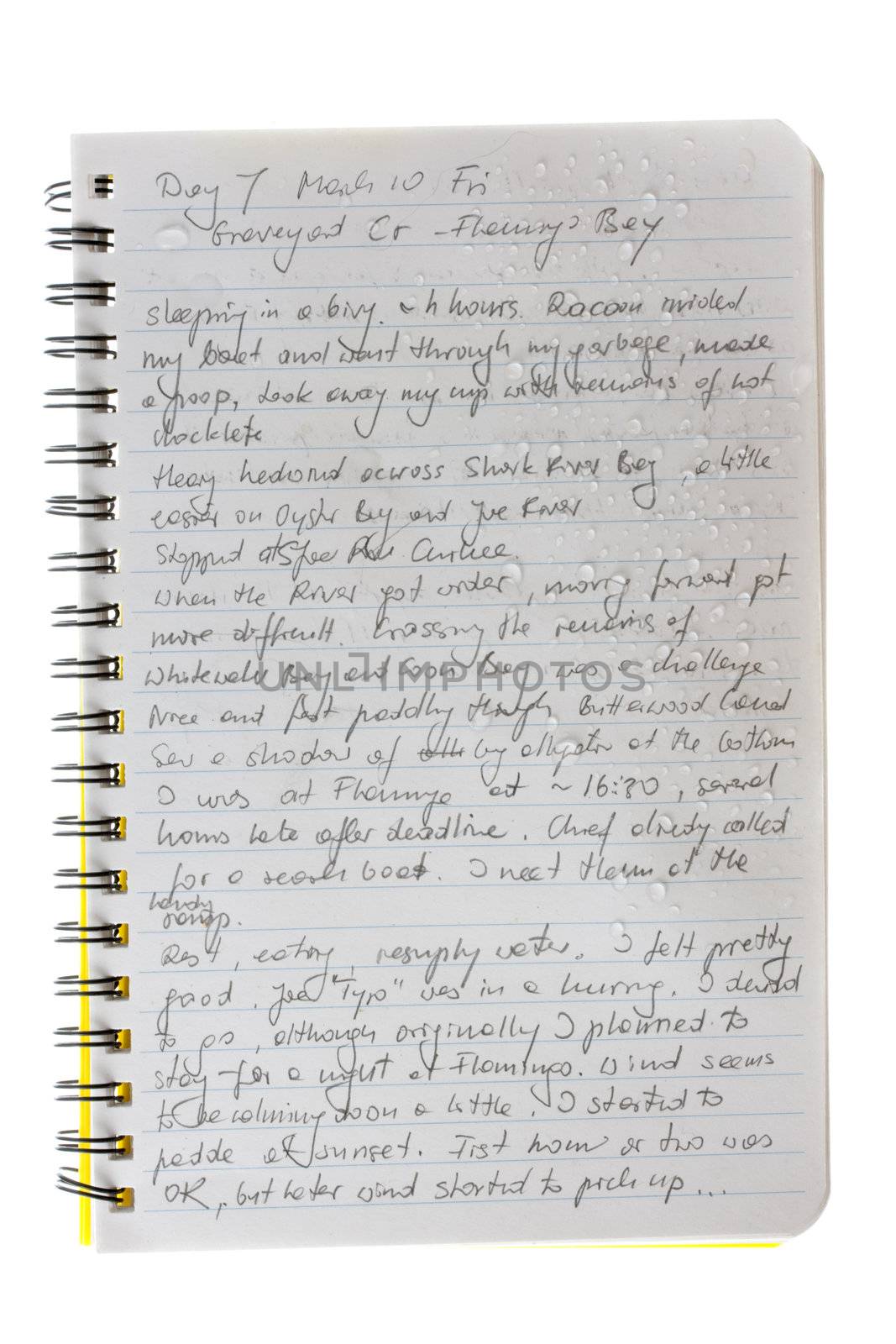 a page from kayak expedition journal handwritten with pencil on waterproof paper with water droplets - my actual writing during 2006 Watertribe Ultimate Florida Challenge, paddling across Everglades