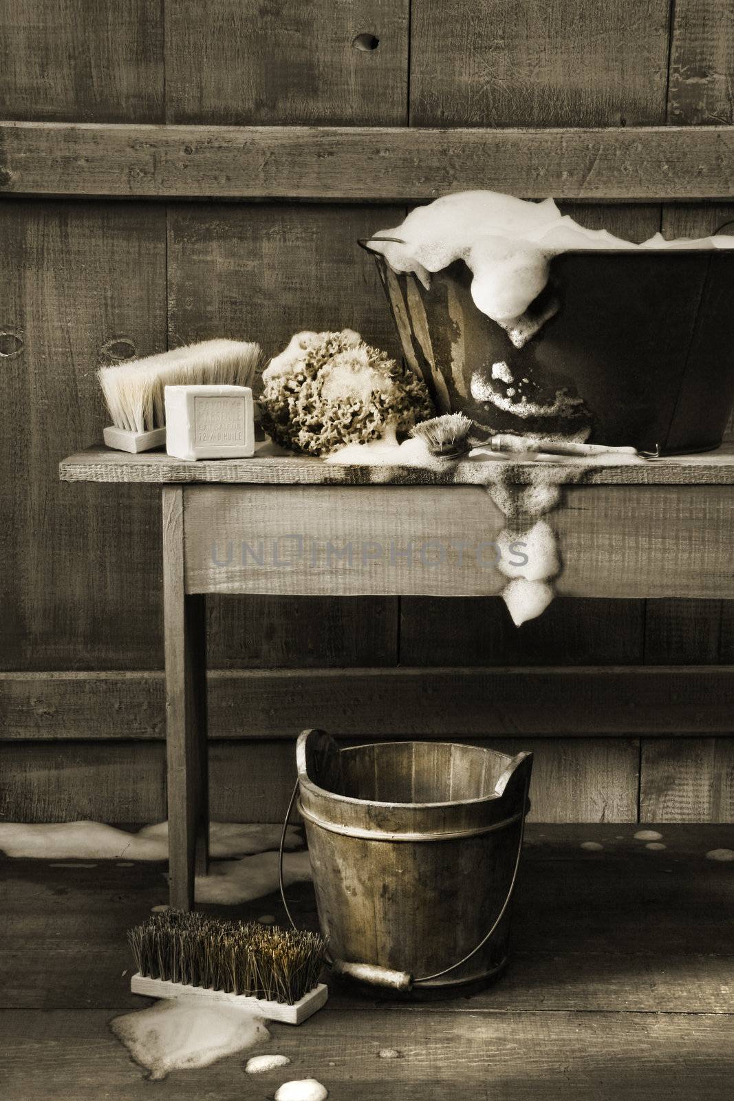 Old wash tub with soap and scrub brushes by Sandralise