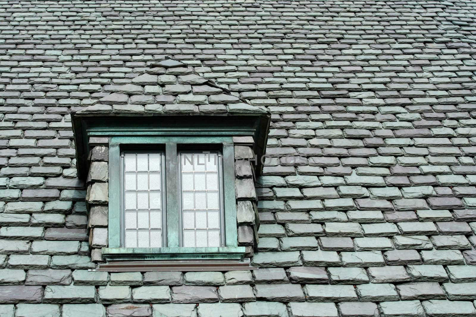 A old slate roof with window
