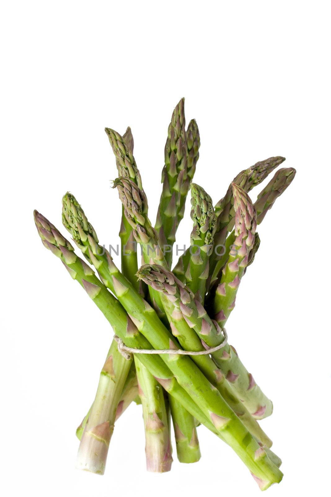 detail of fresh green asparagus isolated on white background by bernjuer