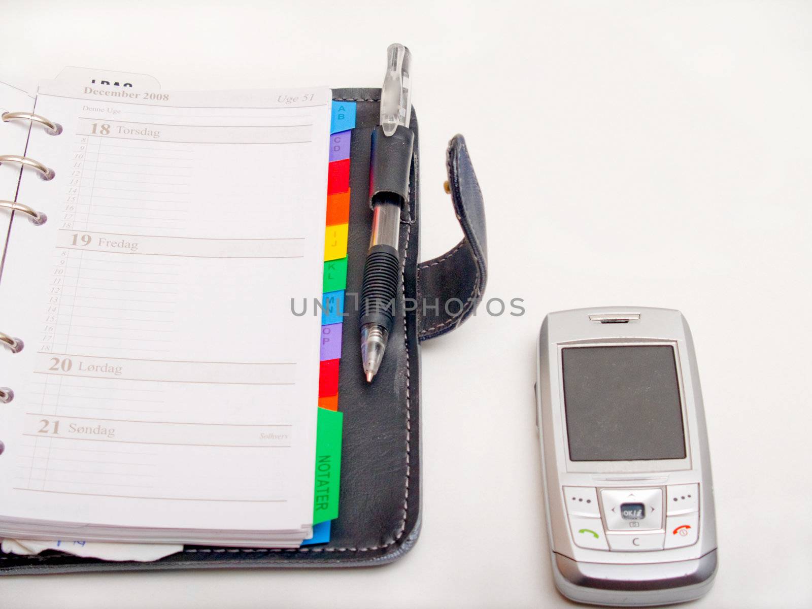 Office objects - Pen diary  and a cell phone 