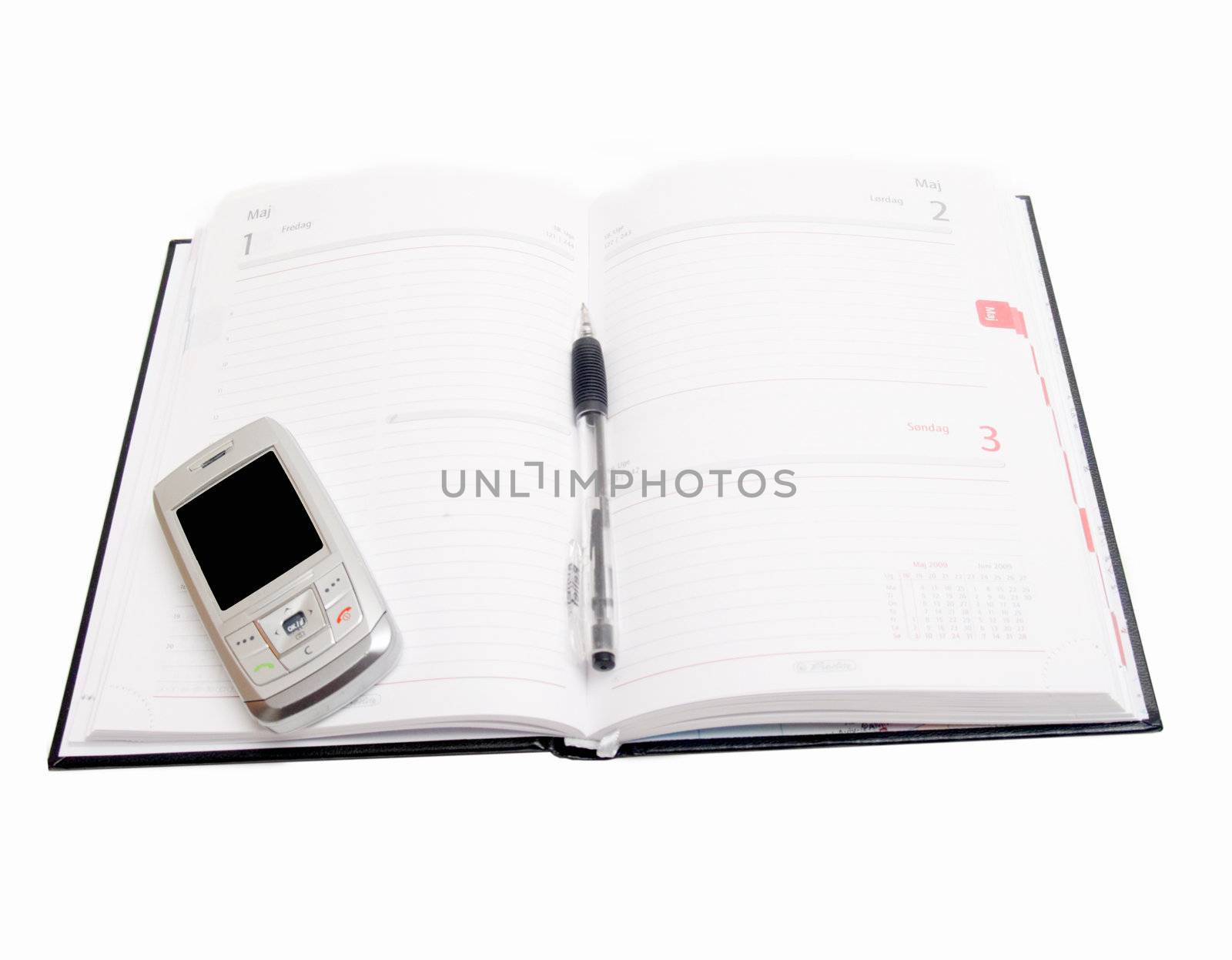 Business Objects - Diary open with cellphone on white