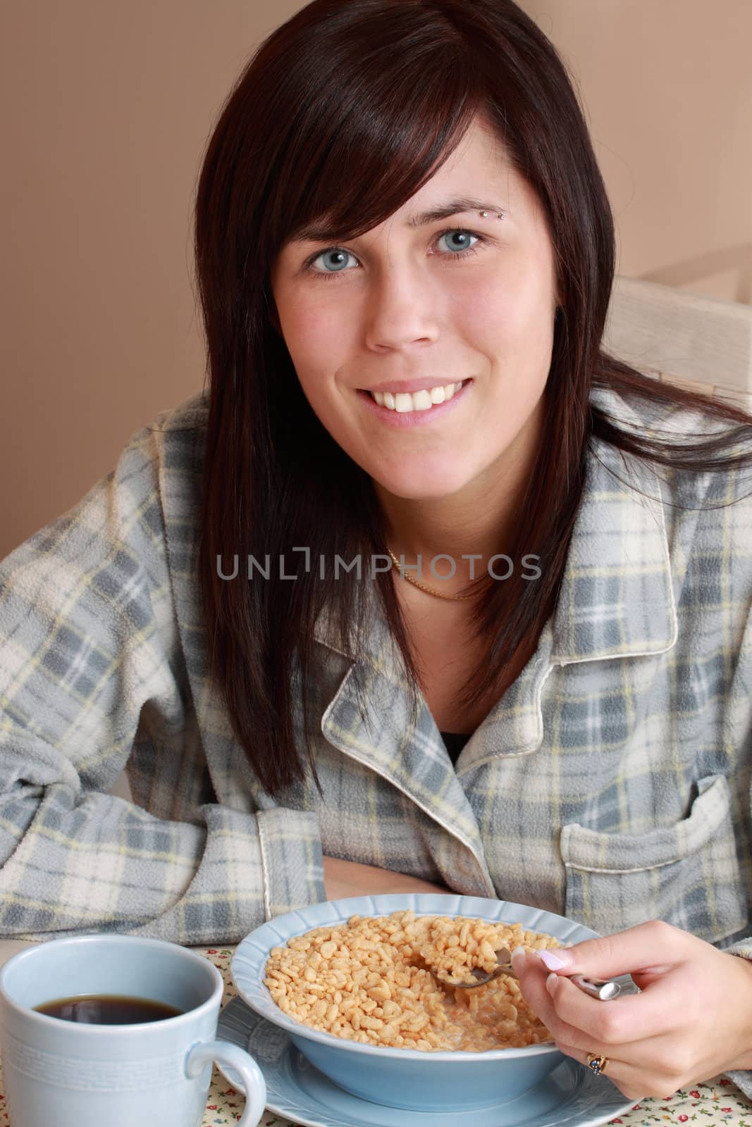 cute brunette girl having healthy breakfast