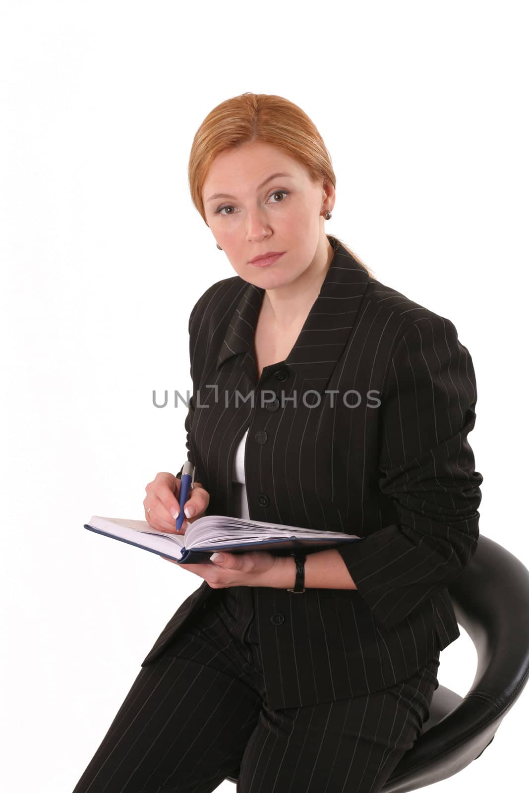 Sitting woman with pen and notebook