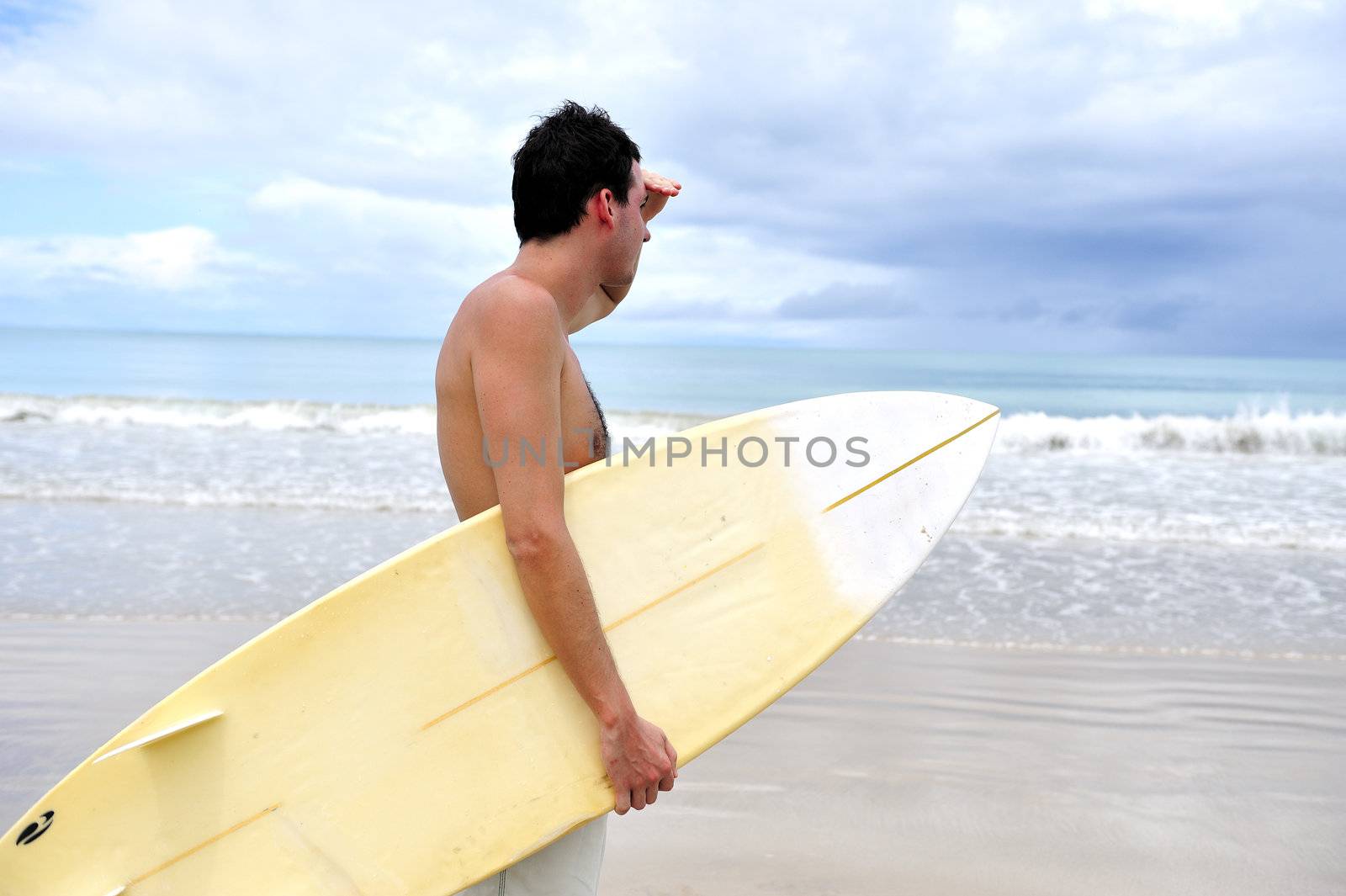 Surfer on the beach in Brazil