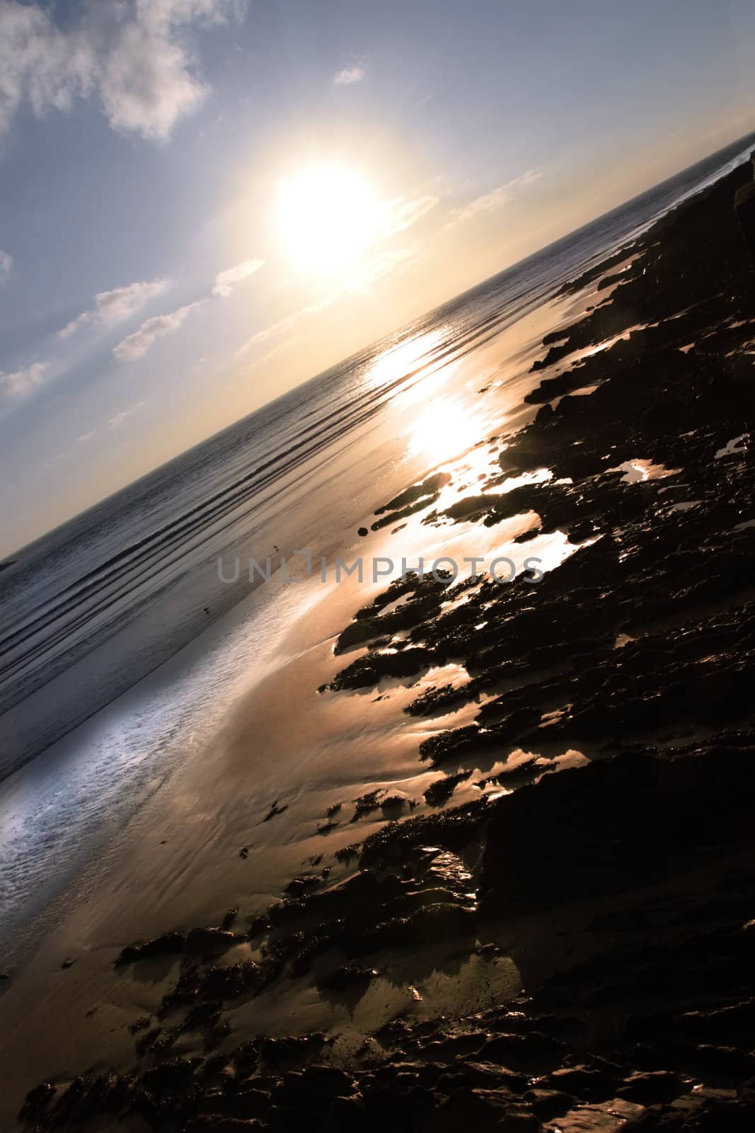 the waves with reflection crashing in on youghal beach ireland