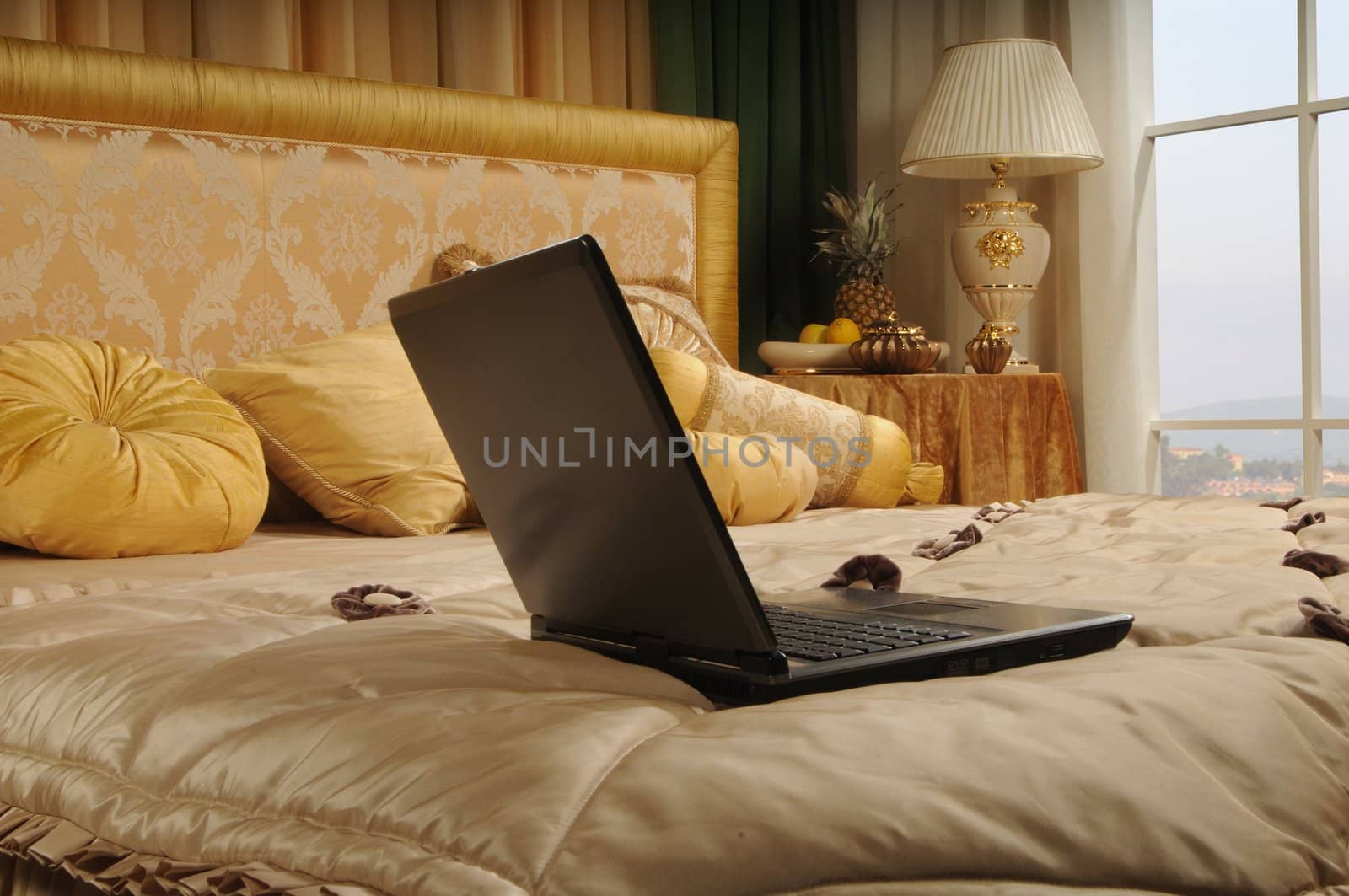 laptop on a bed by dyoma