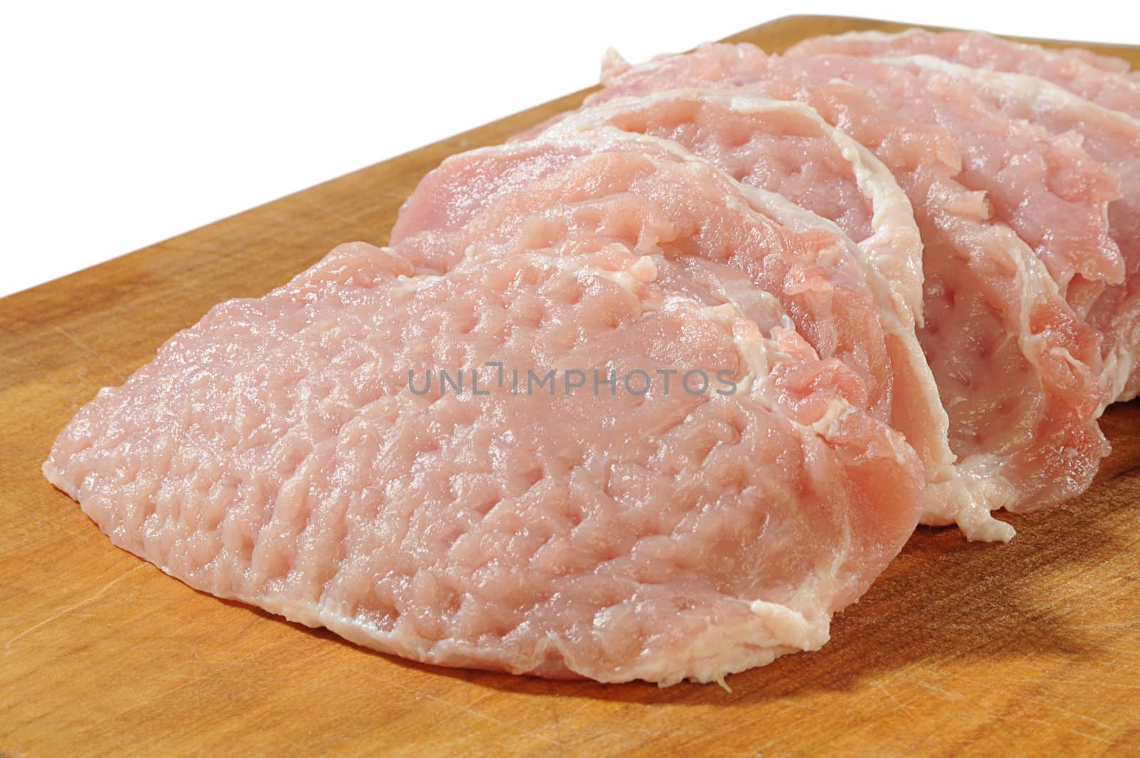 removed and cut raw undercut of pork