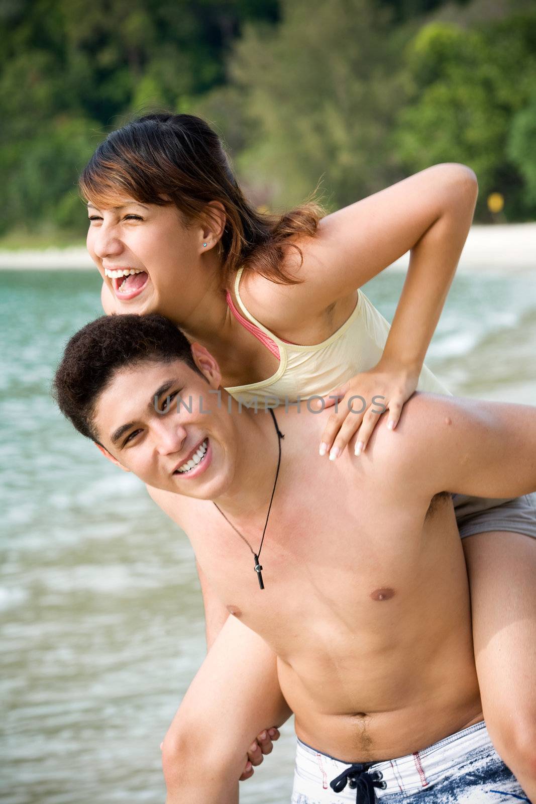 couple having fun with each other by the beach
