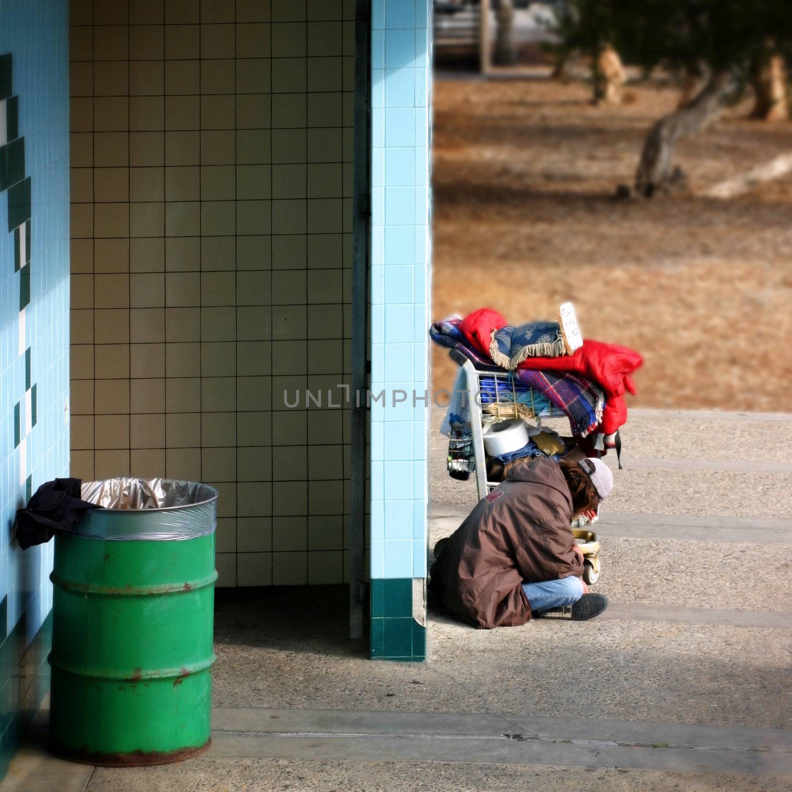 Life is hard in California! A homeless person sitting in Ventura, CA near the beach, waiting for � a better live?