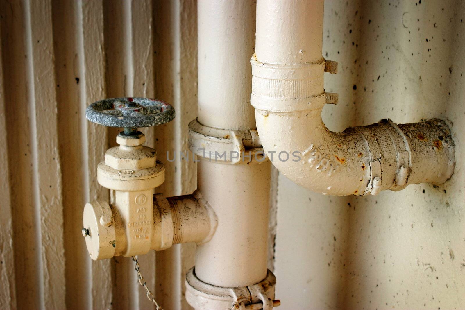 Some pipes in a parking structure.