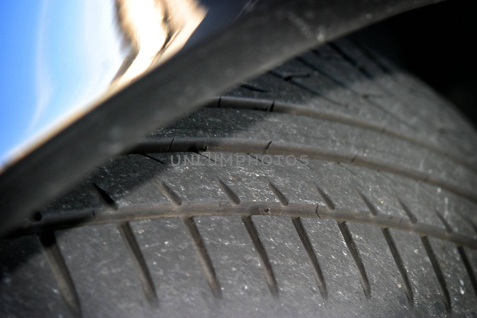 Tire of a car in a parking lot