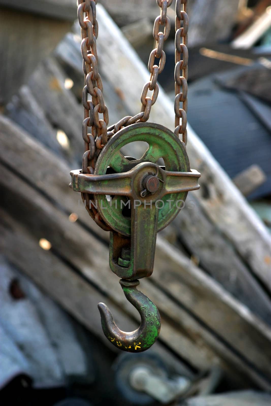 A block and tackle in a junk yard.