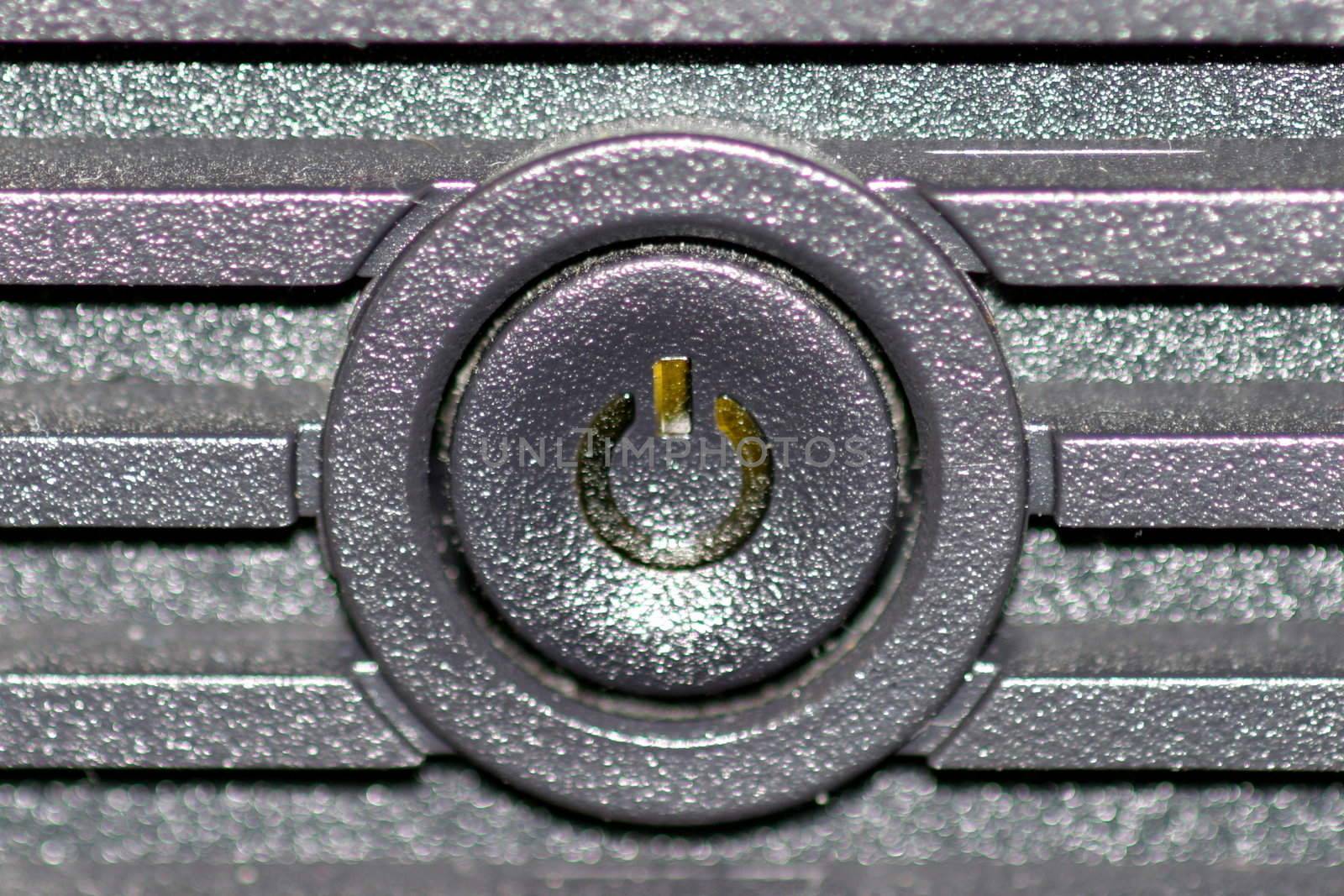 Black on and off button from the front of a computer