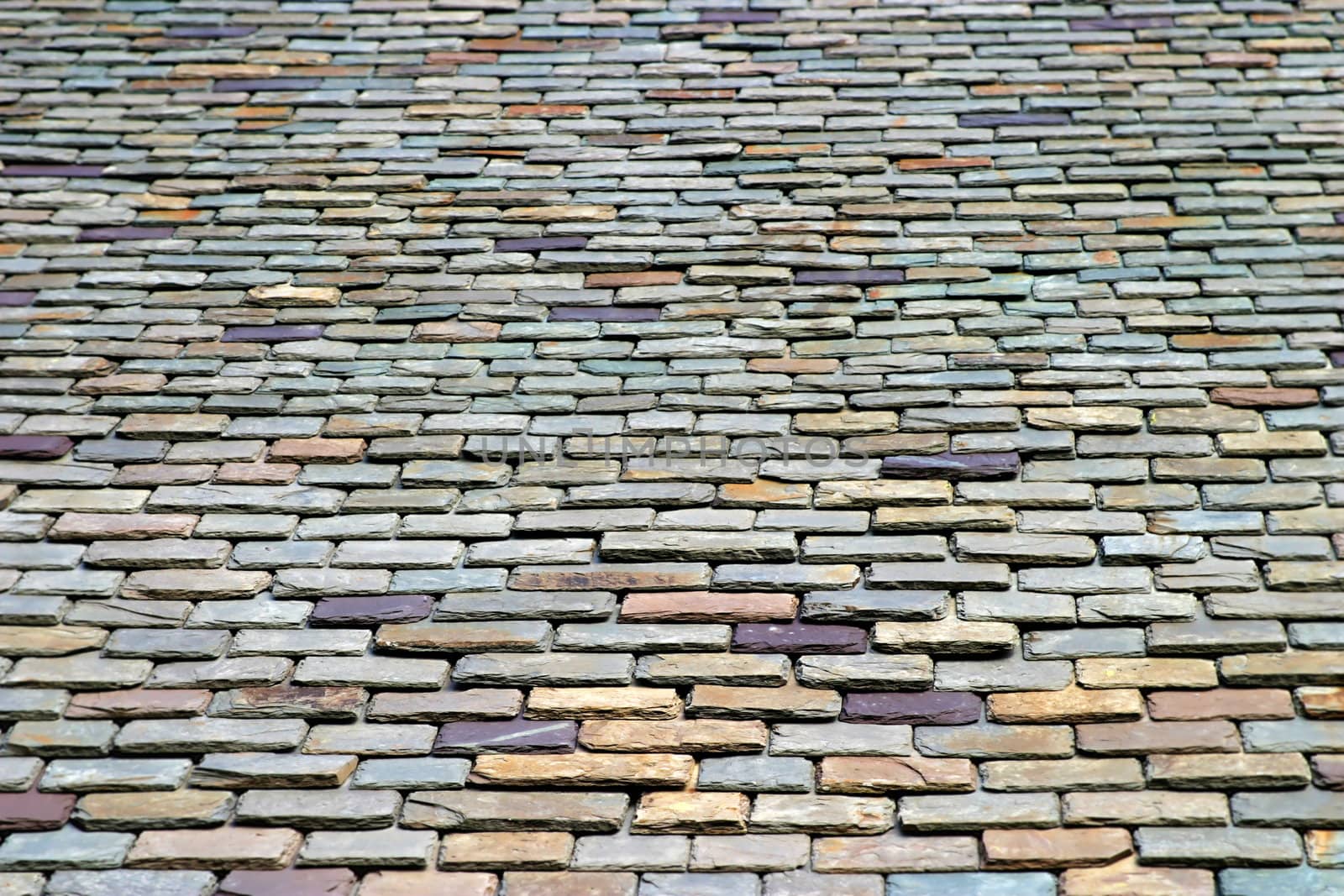 Colorful stone roof tiles from below