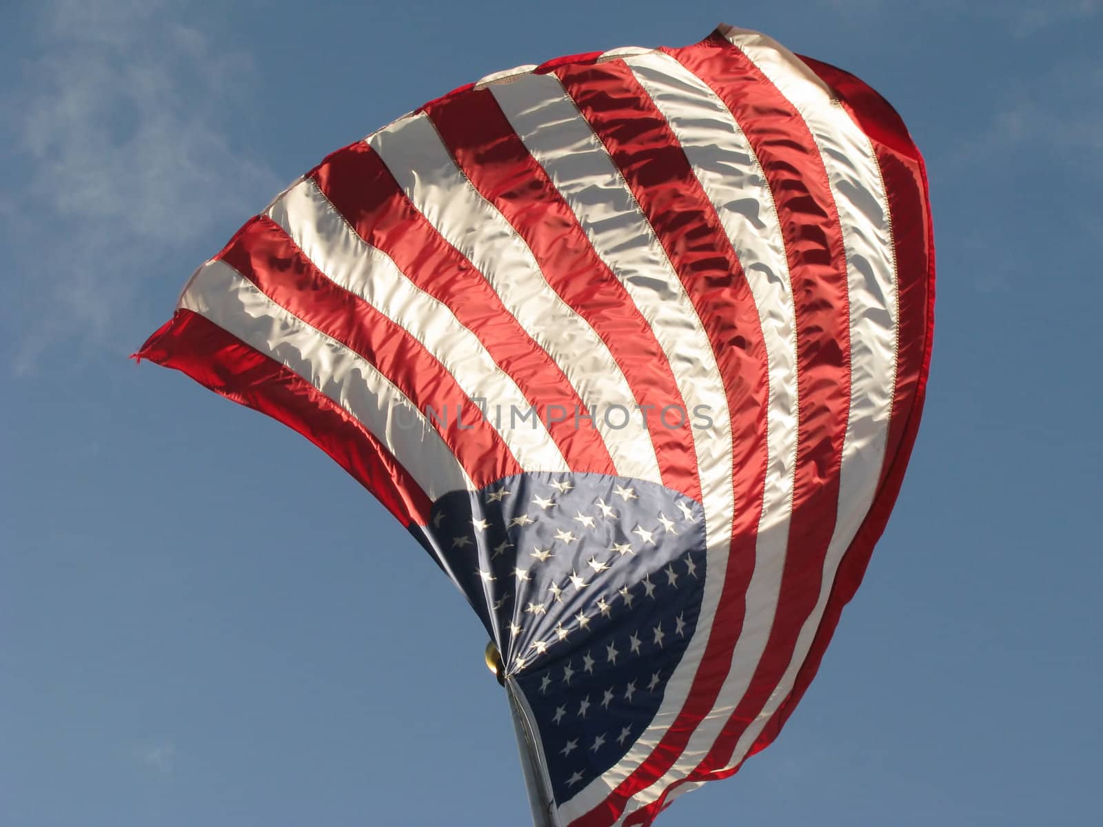 American Flag v4 with Red White and Blue colors set against a blue sky with white clouds.