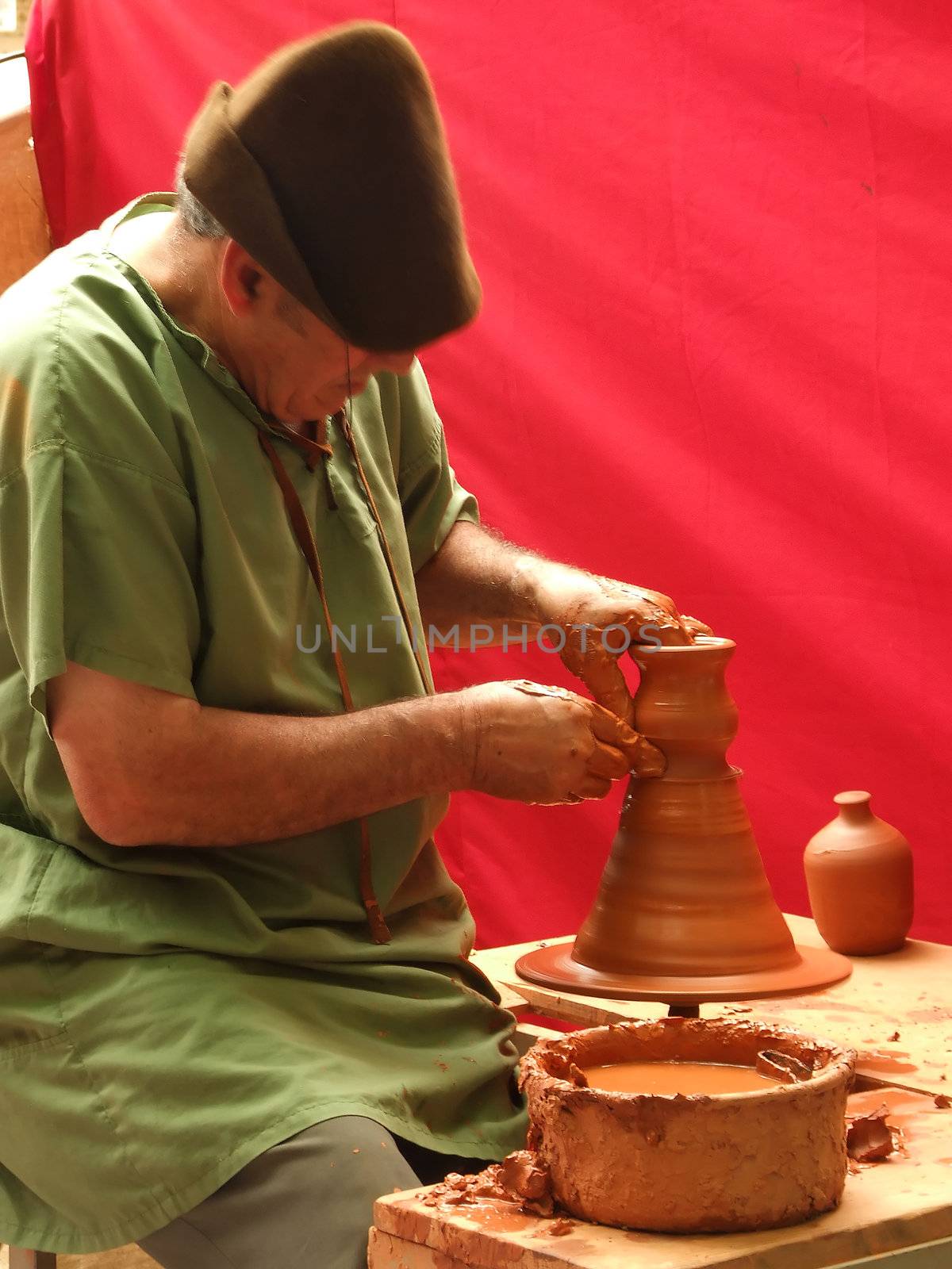 Old men doing a clay pottery