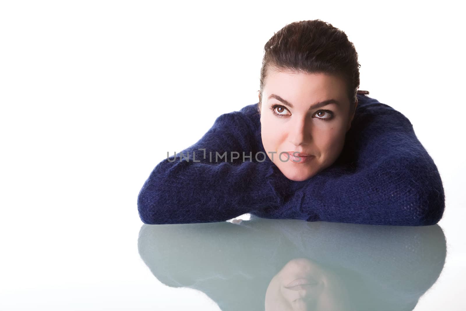 Portrait of a young woman with thoughtful expression. Isolated on white background.