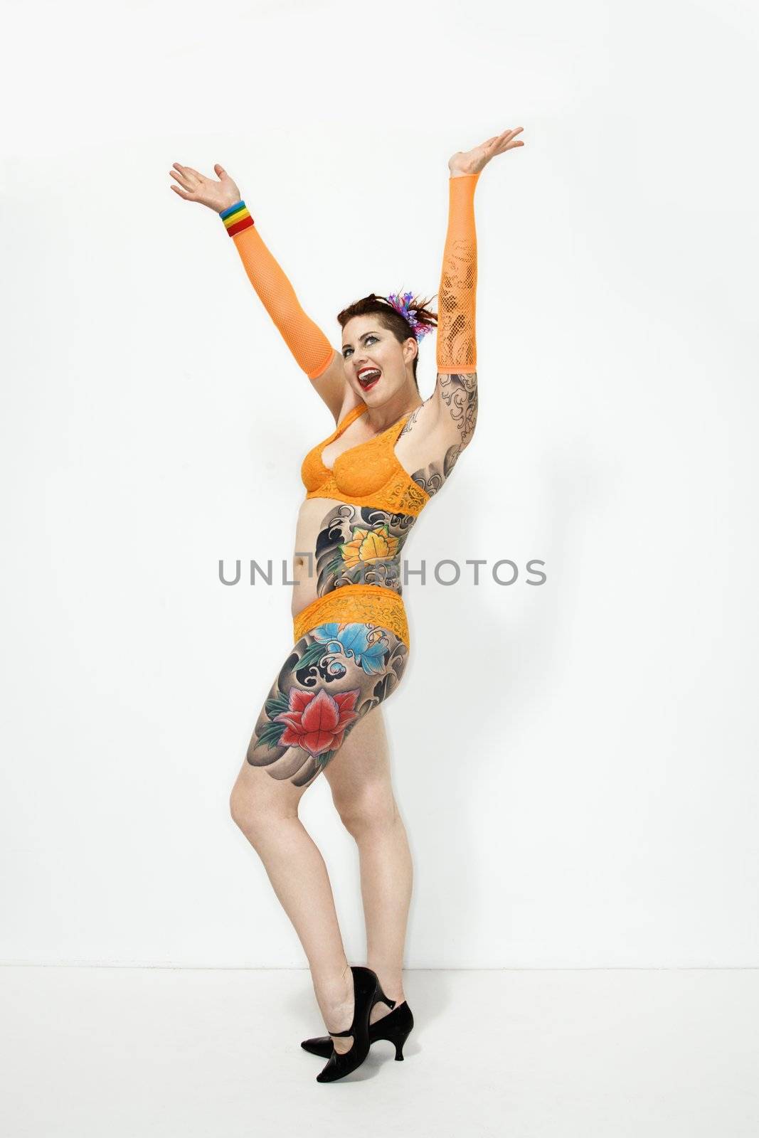 Happy tattooed woman. by iofoto