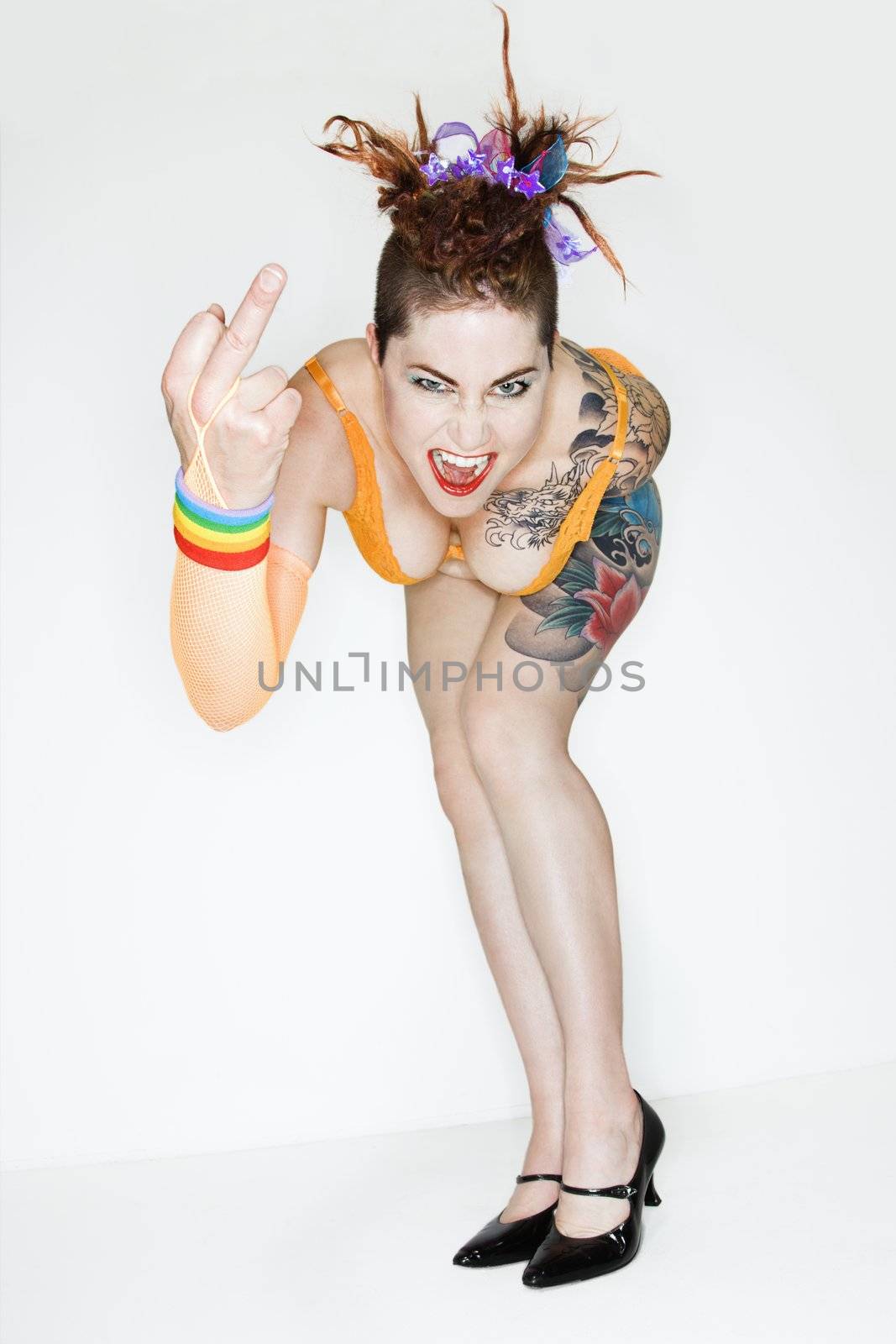 Angry tattooed woman by iofoto