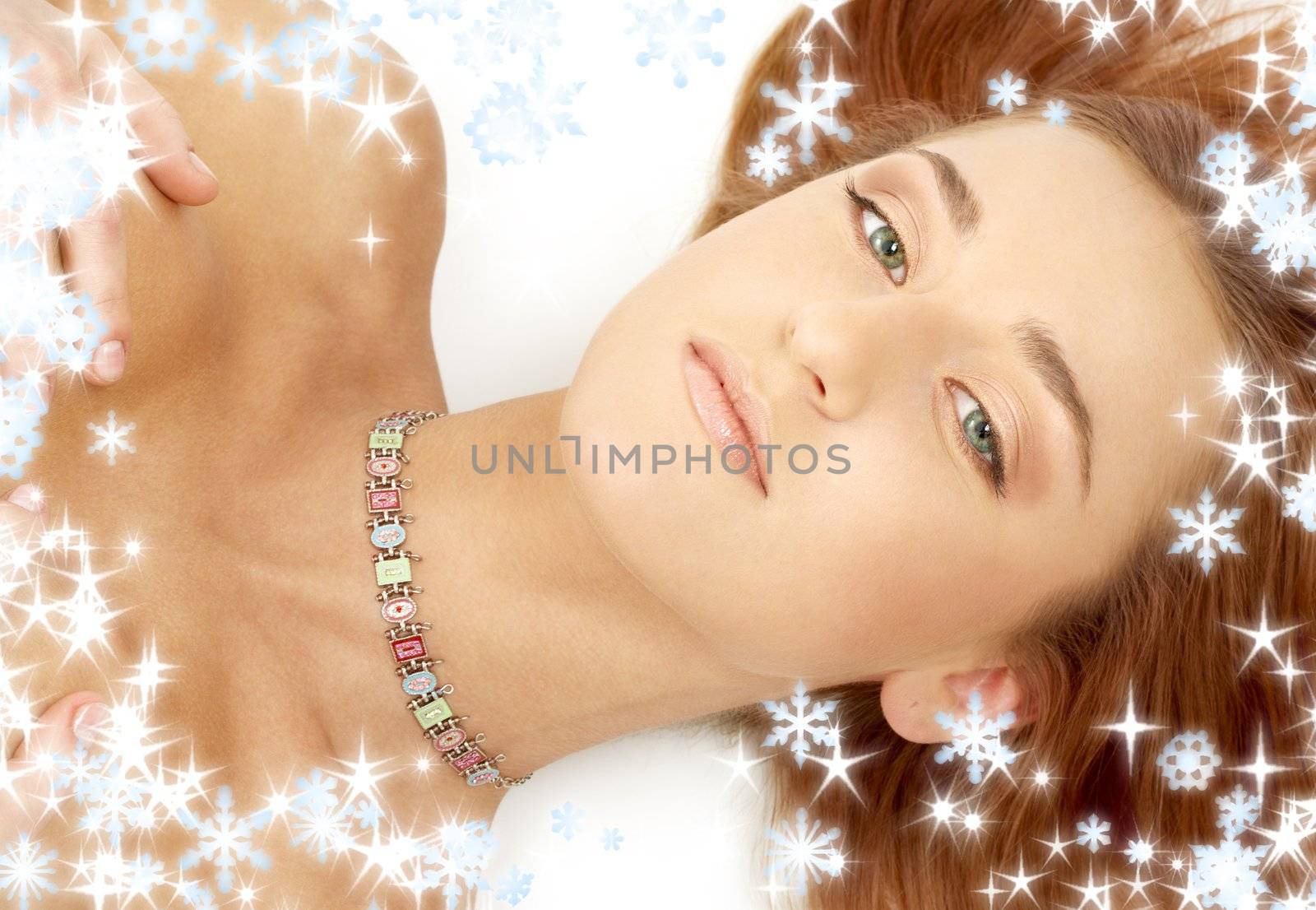 picture of green eyed redhead in collar with snowflakes